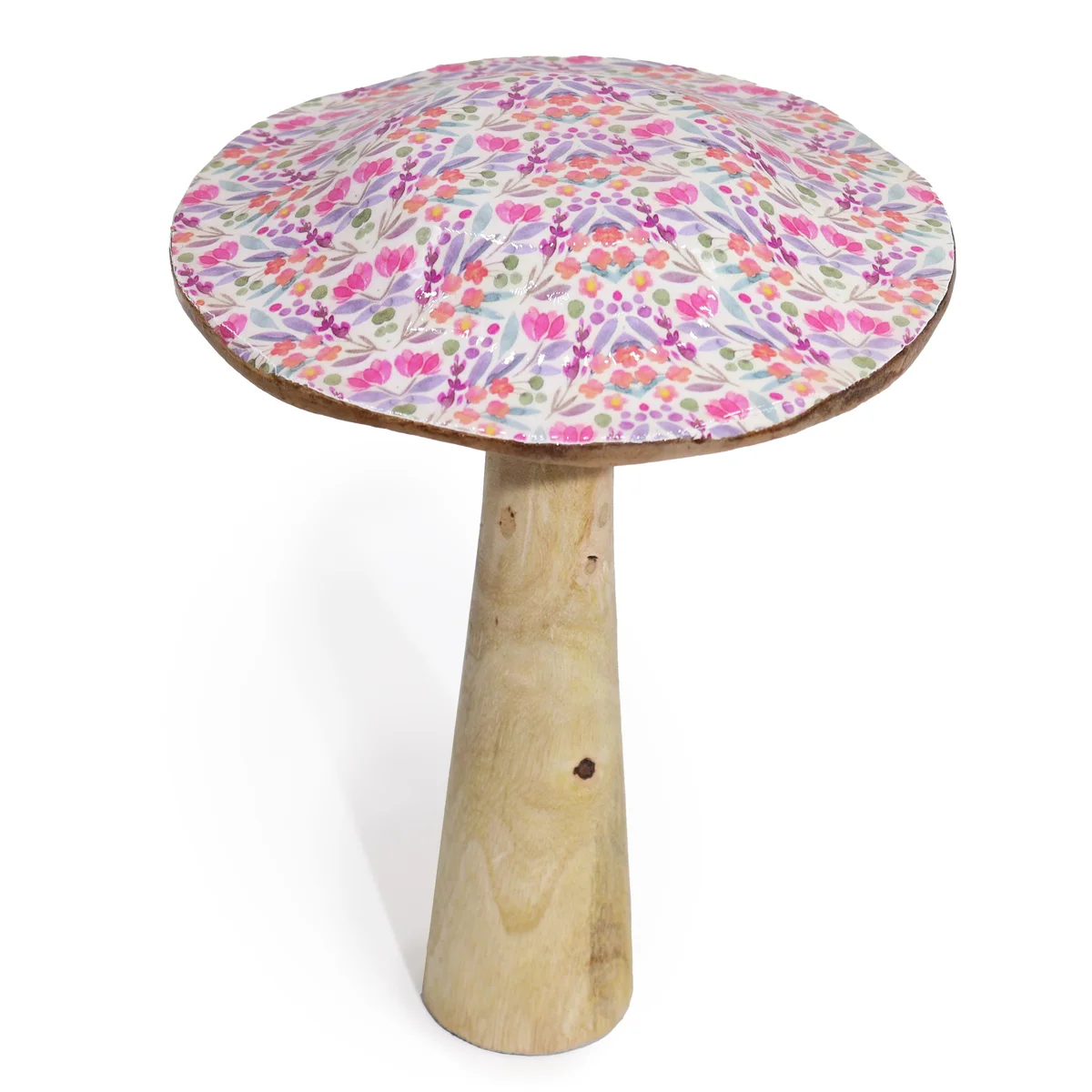 Large wooden mushroom decorated with pretty floral patterns on its cap against a white background