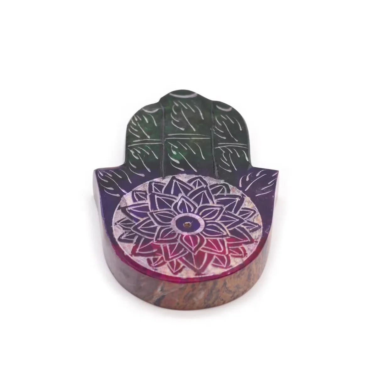 Soapstone incense burner shaped like a Hamsa hand with a lotus flower design, carved from smooth soapstone material