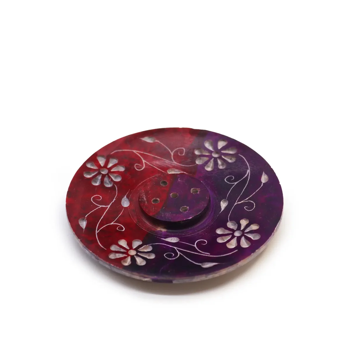 Soapstone disc incense holder with floral design, holds five incense sticks, natural stone texture visible