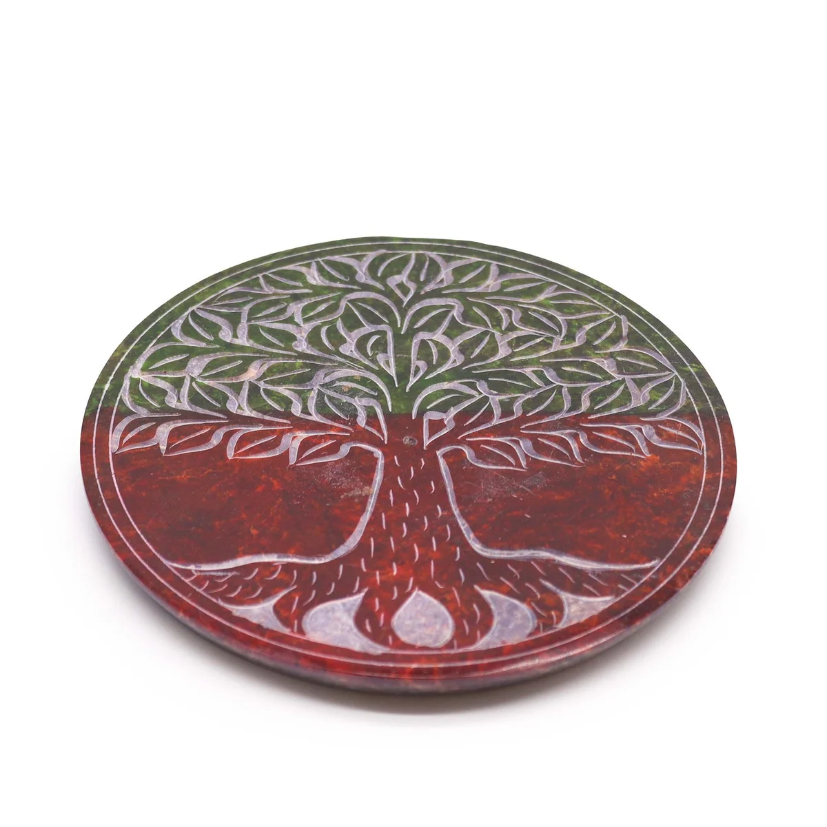 Round soapstone incense holder with Tree of Life design carved on disc surface, for burning incense sticks.