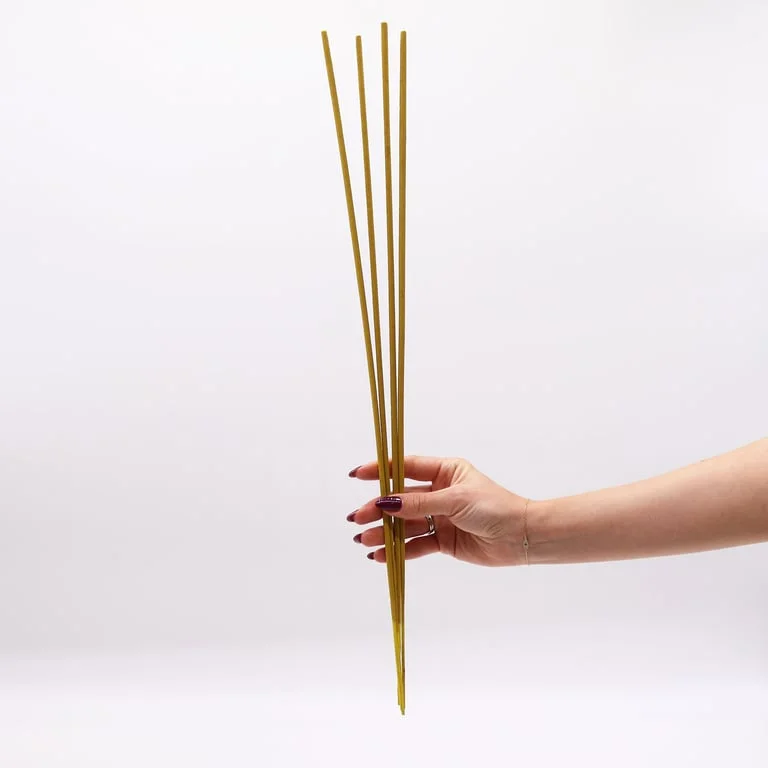 Bundle of 50cm citronella garden incense sticks with green and yellow packaging for outdoor use