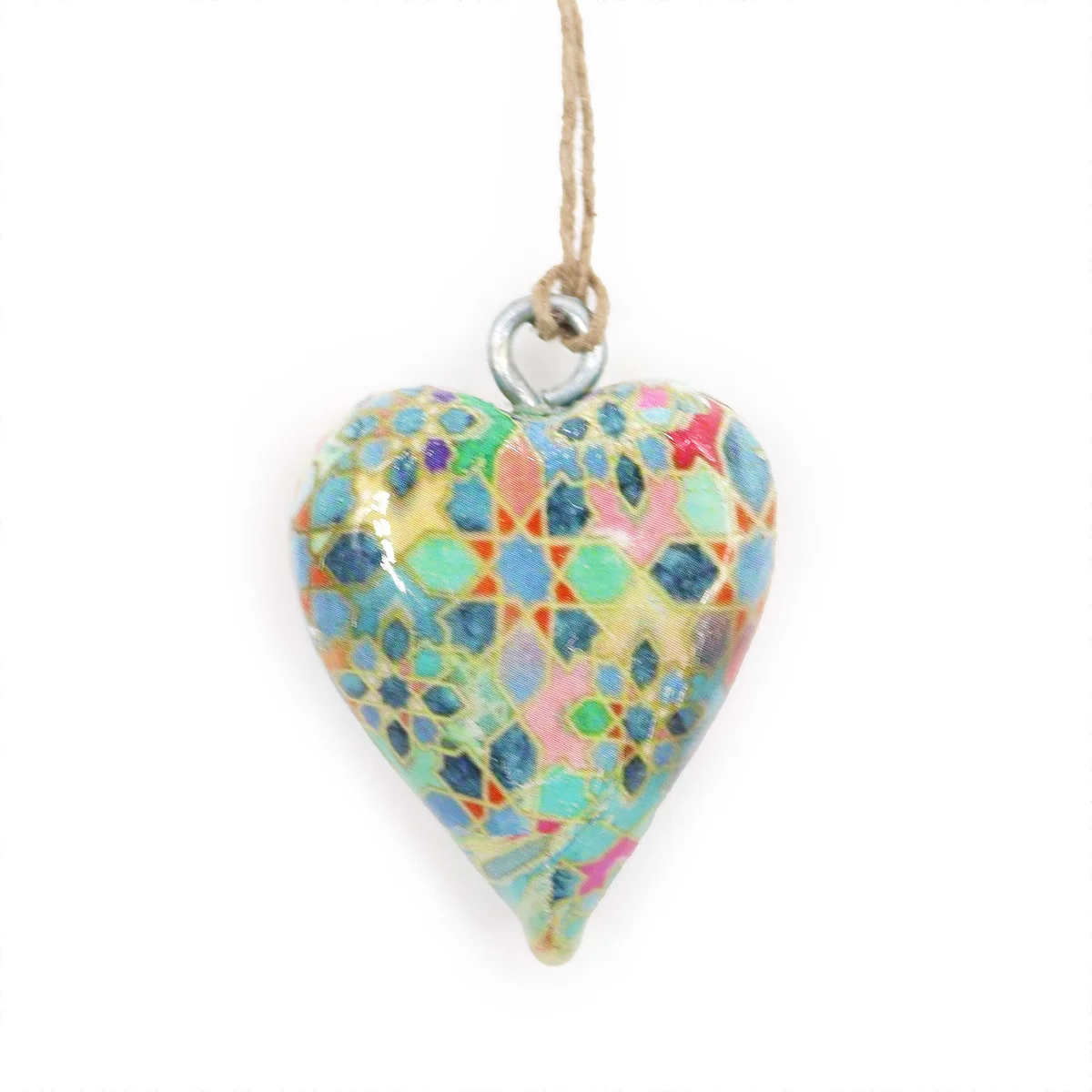 Small wood ornament, heart‑shaped with Mediterranean tile pattern.