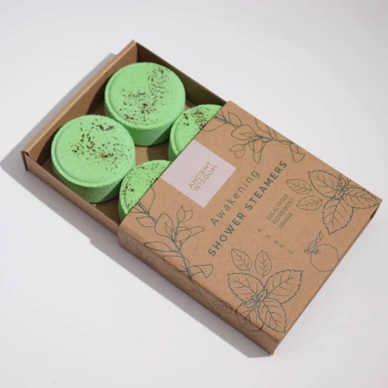 Awakening shower steamers in therapy wellness gift set with calming Zen packaging and natural ingredients displayed