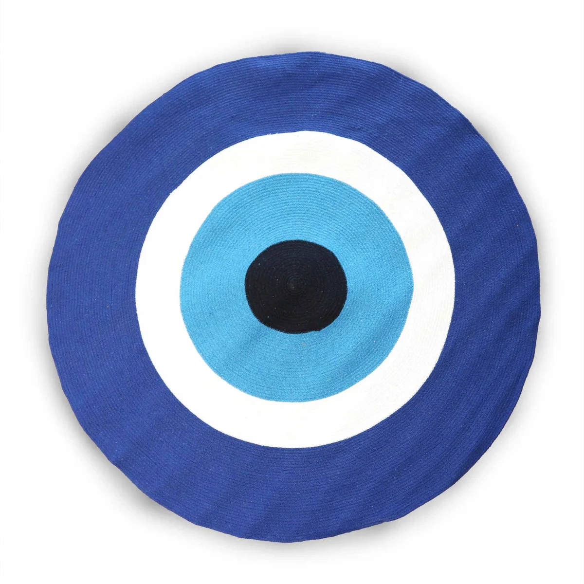 Round cotton rope evil eye rug with blue and white pattern on a flat surface