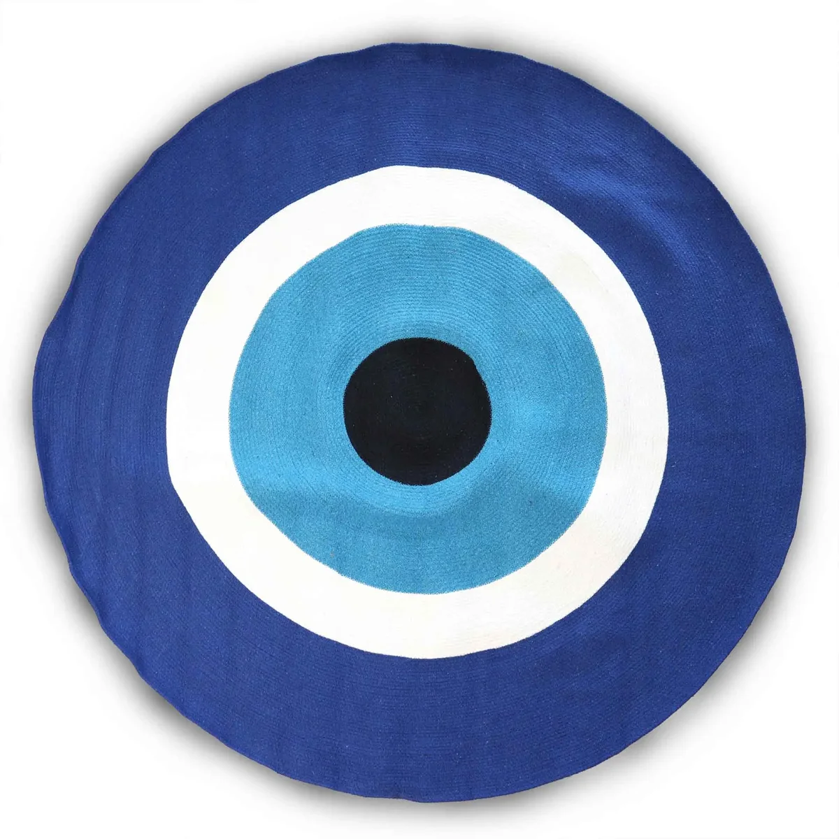 Round cotton rope evil eye rug with blue, white, and black concentric circle design on a white background