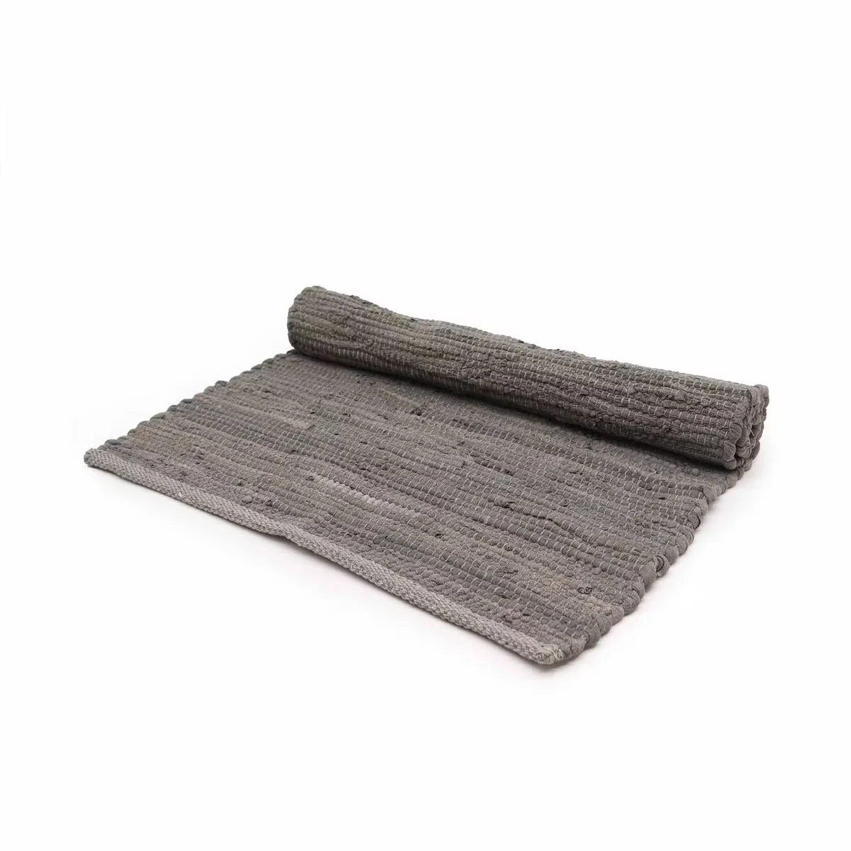 Small charcoal handwoven cotton rug with traditional Indian handloom texture, folded on a white background