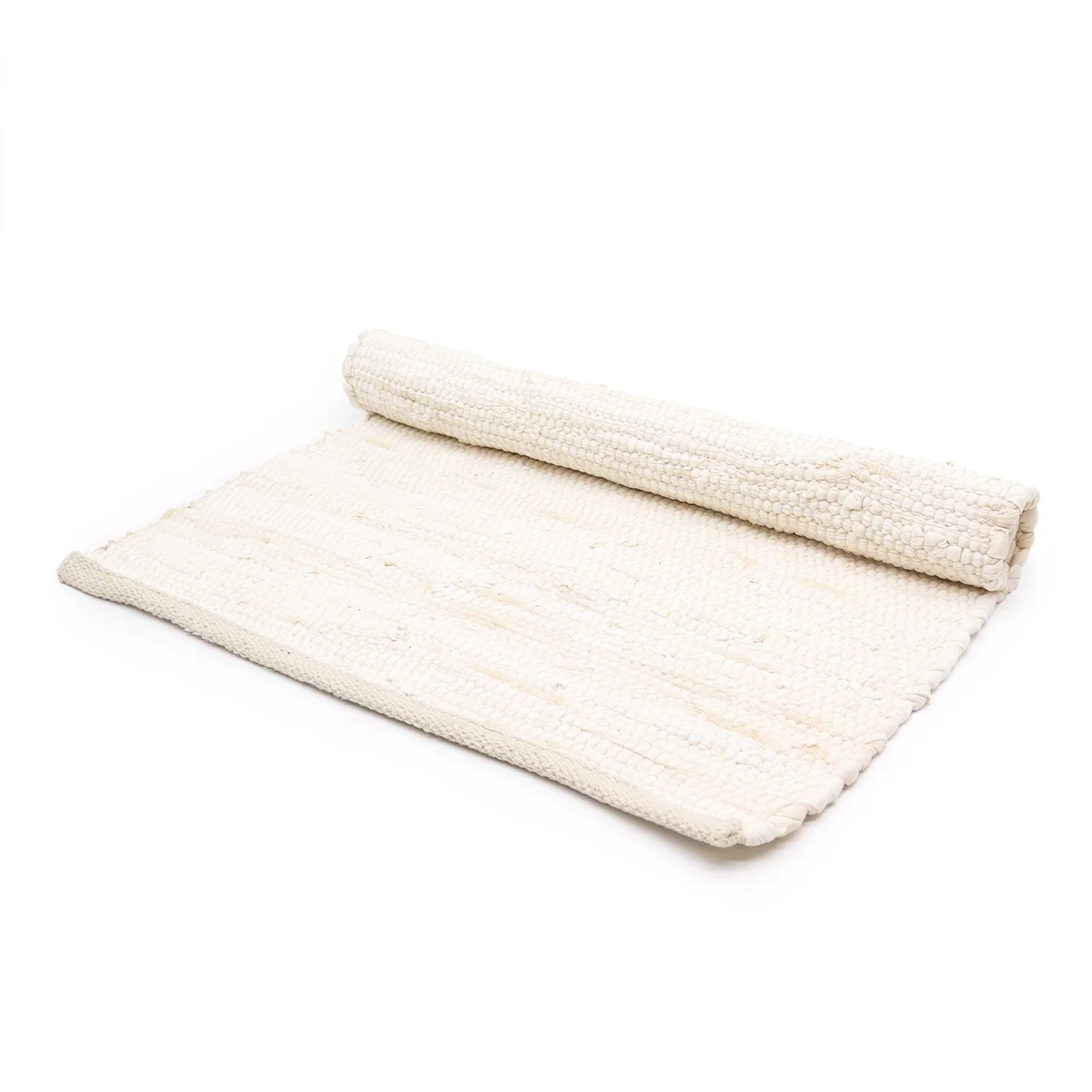 Cream handloom cotton rug with intricate weaved pattern, medium size, laid on a wooden floor.