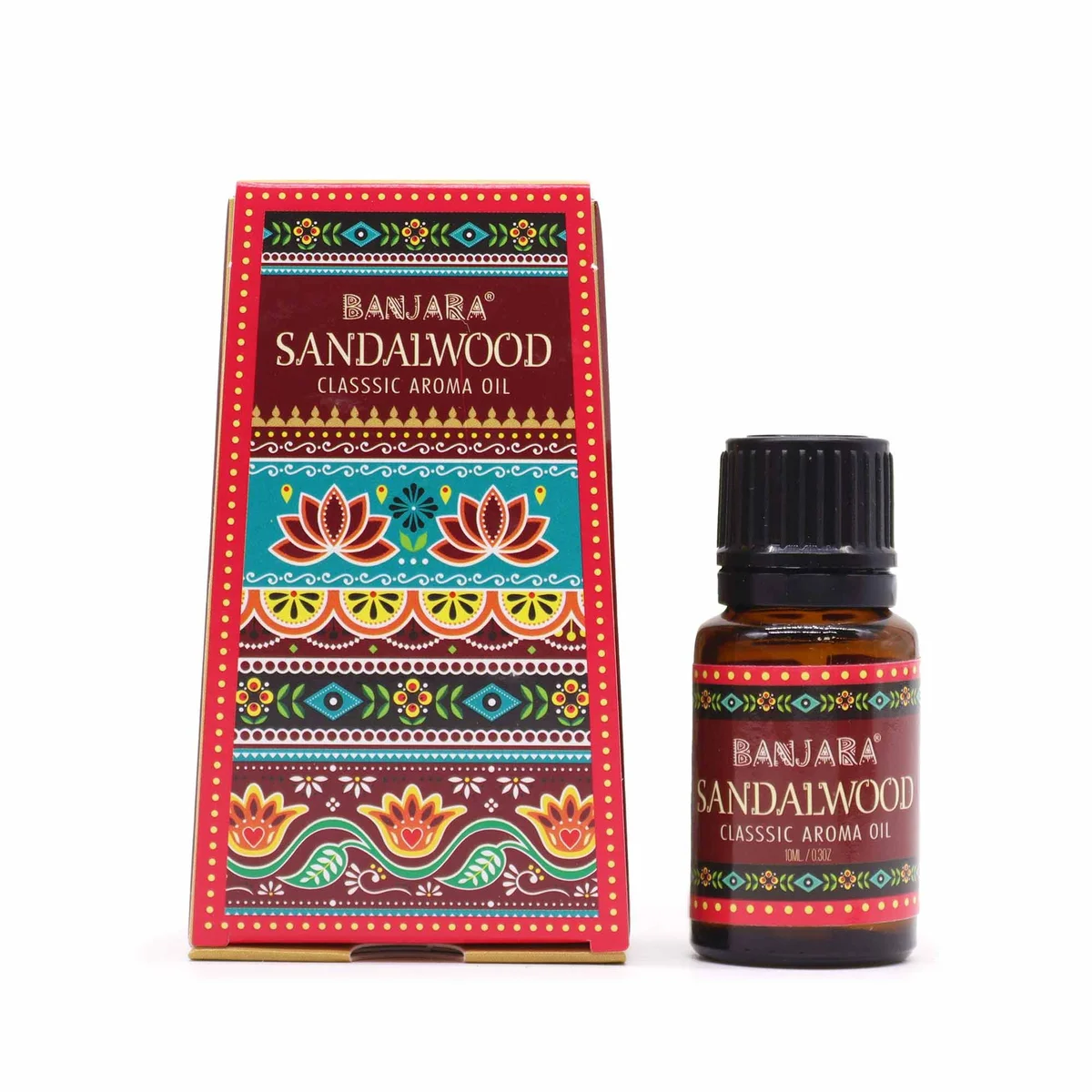 Small 10ml bottle of Banjara Indian sandalwood fragrance oil with label on plain background