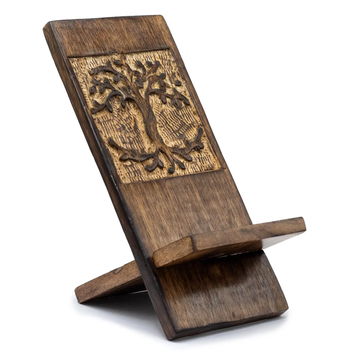 Wooden carved phone stand featuring an intricate Tree of Life design, holding a smartphone upright on a flat surface