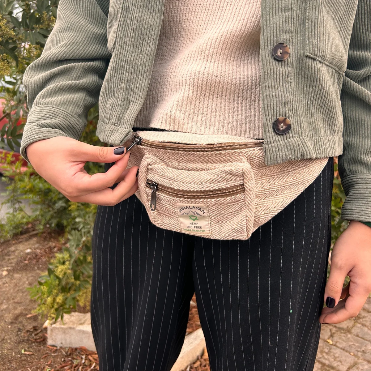 Natural cotton hemp style fanny pack with adjustable belt strap and zippered main compartment in beige color