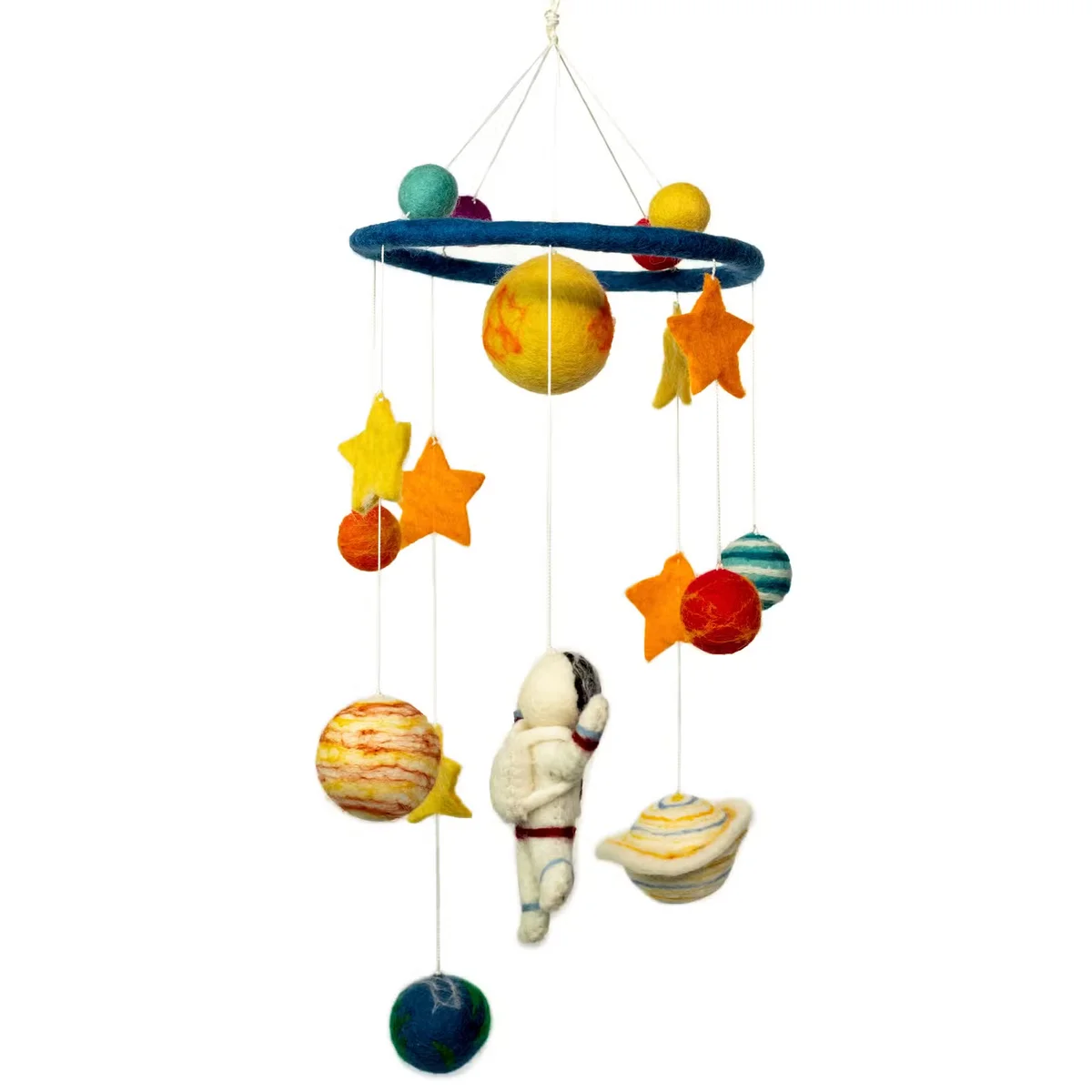 Handmade felt mobile featuring a starman and planets, perfect handmade nursery decor for a child's room.