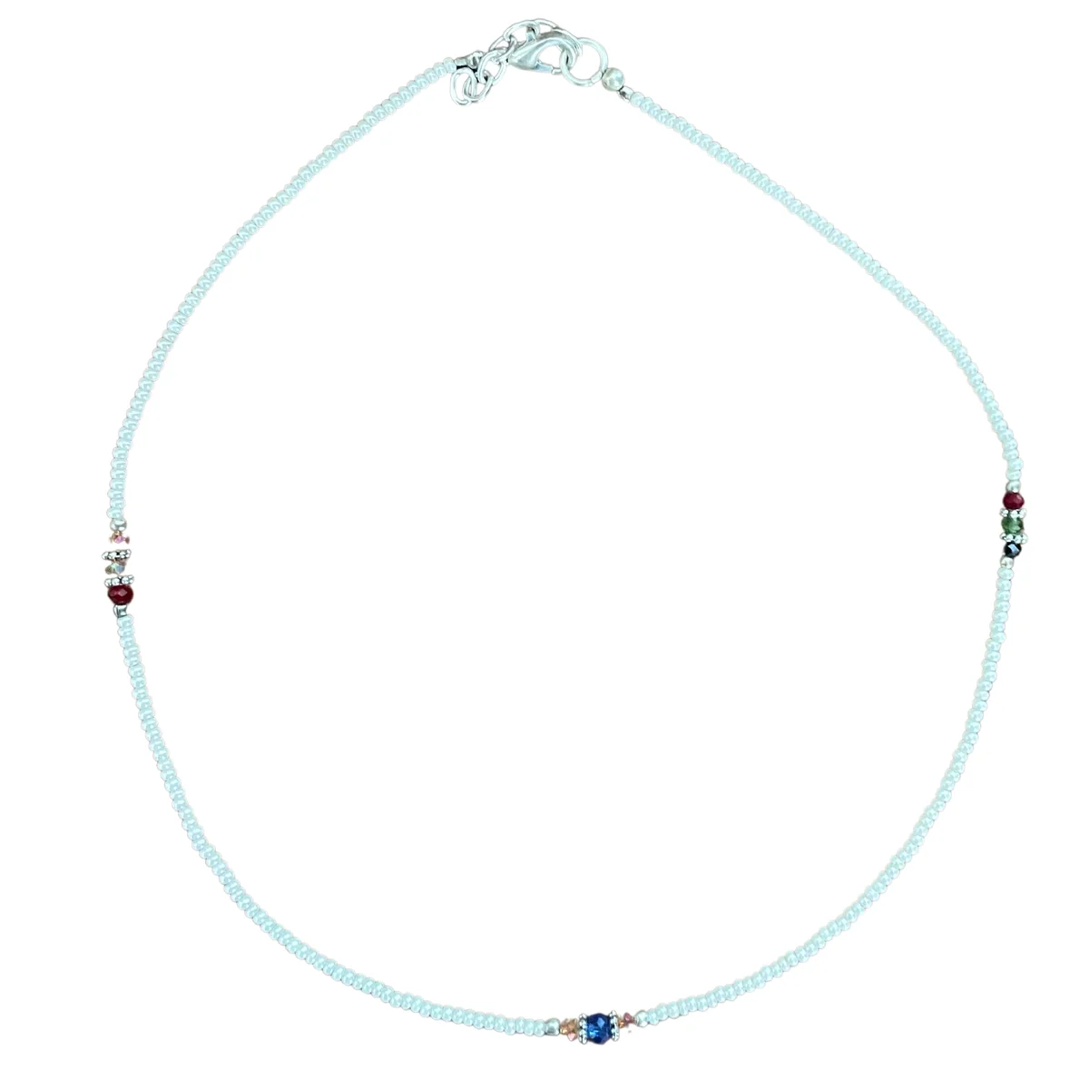 Close-up of Nepalese extra fine gem necklace featuring pearls and cut beads on a dark background