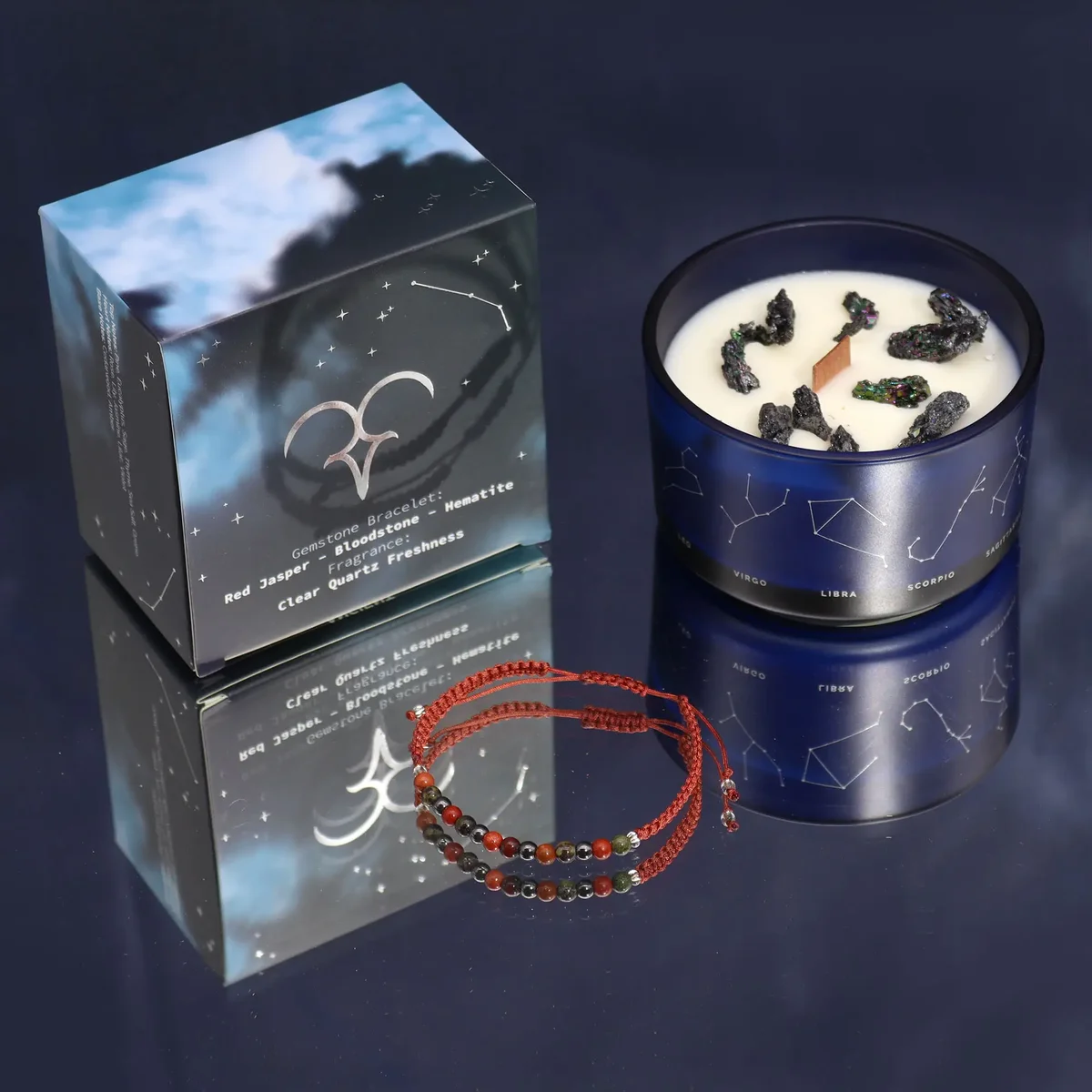 Aries candle gift featuring a zodiac crystal candle and a matching gemstone bracelet on a white background