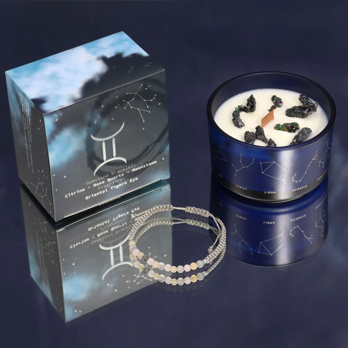 Gemini crystal candle with zodiac symbol and matching gemstone bracelet displayed on white background