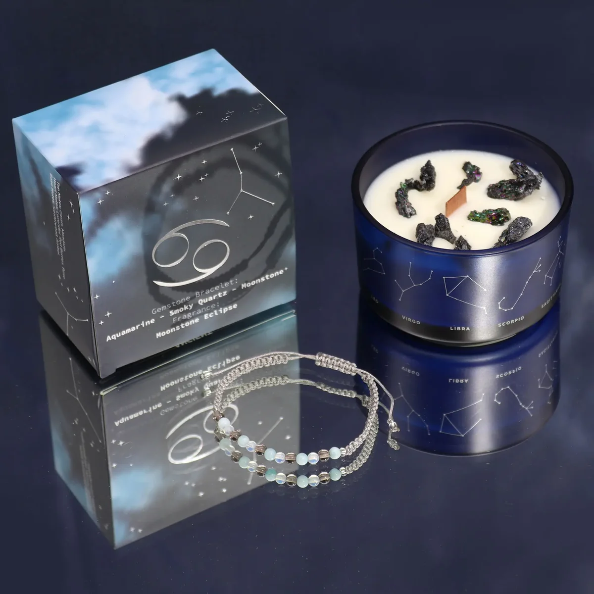Zodiac crystal candle with a Cancer gemstone bracelet wrapped around the glass, featuring soft lighting background