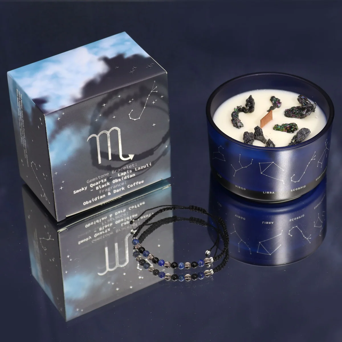 Zodiac crystal candle for Scorpio with a lit candle and a matching gemstone bracelet wrapped around the jar