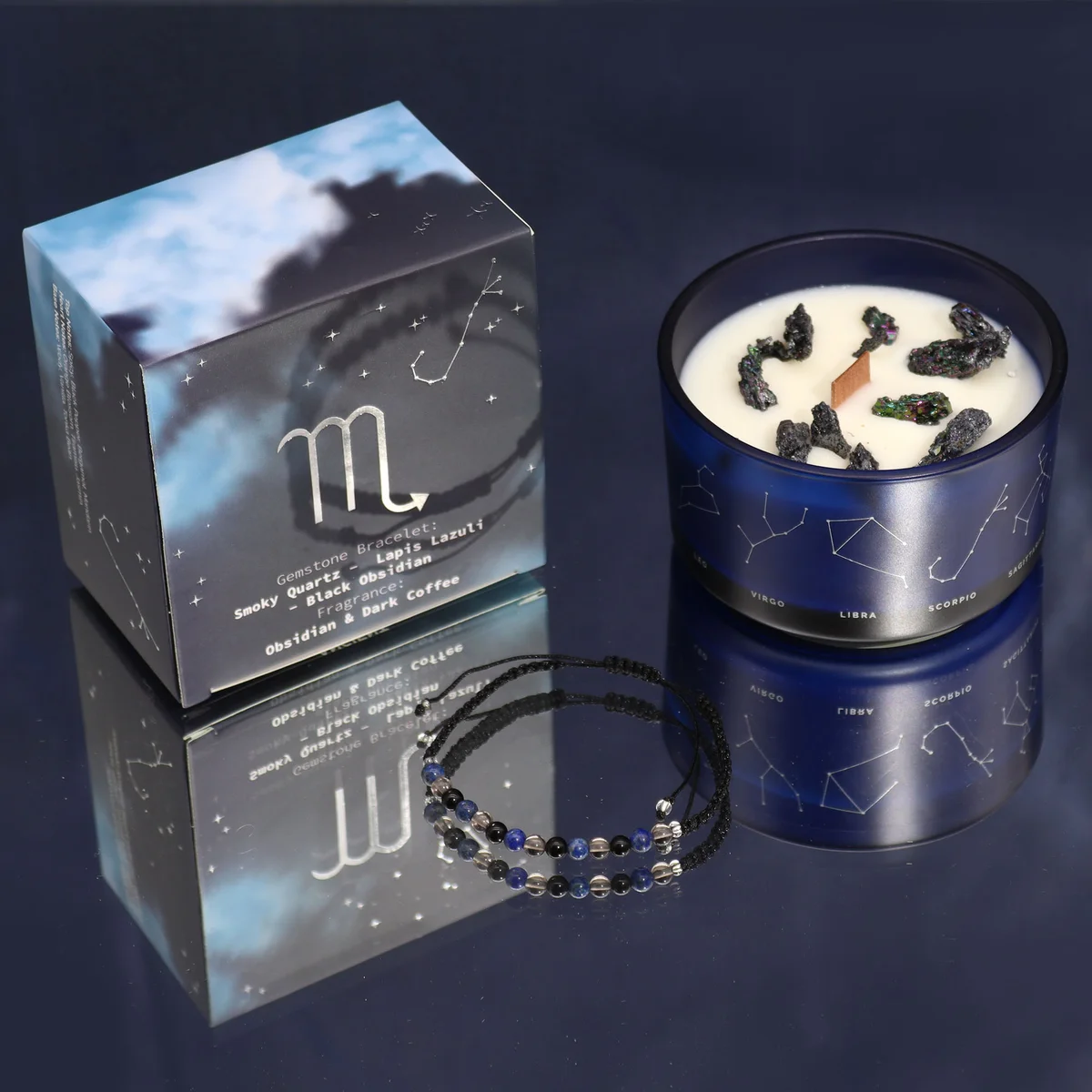 Scorpio zodiac crystal candle gift with gemstone bracelet beside the candle on a white background