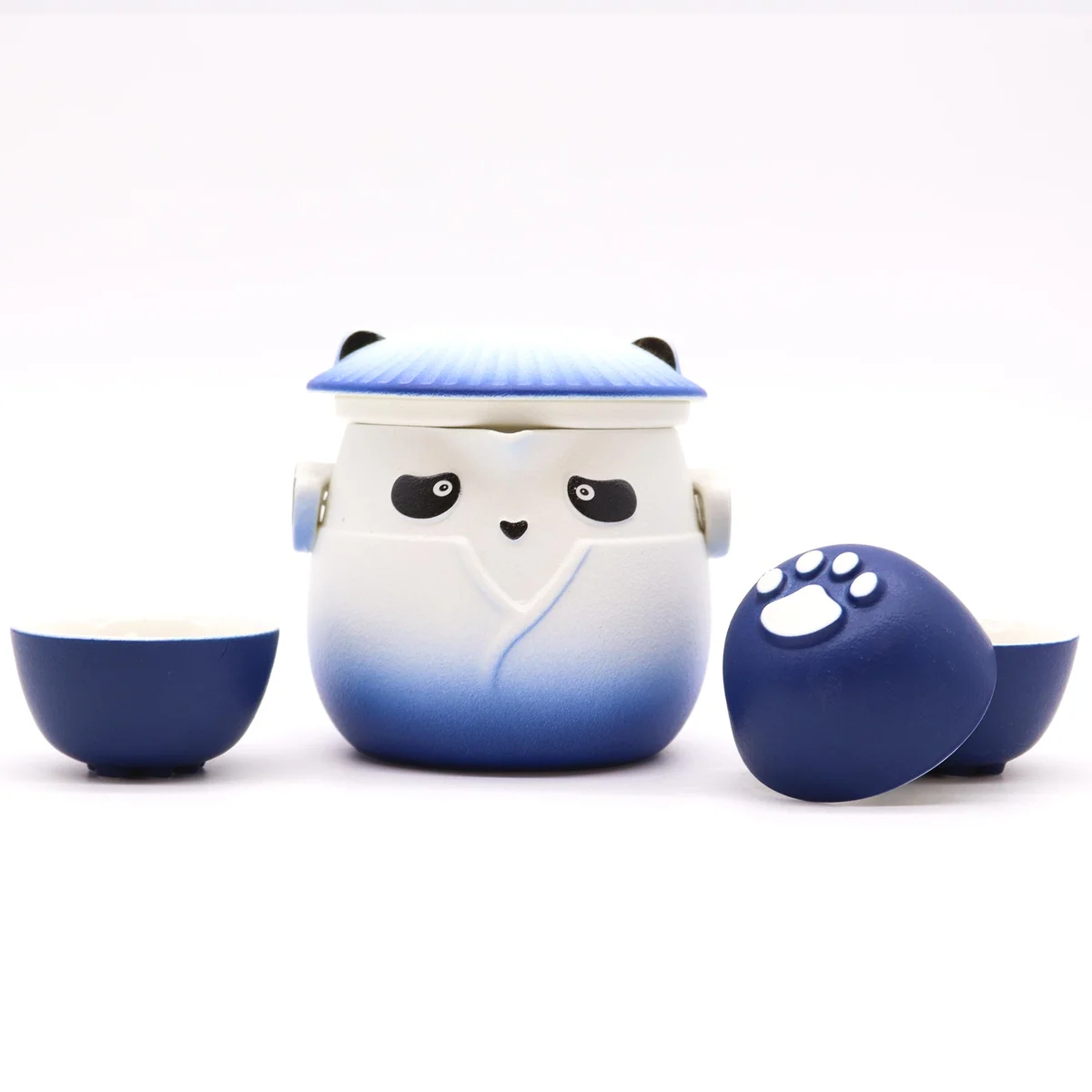 Sky blue panda-themed tea set with teapot and three matching cups arranged on a white surface
