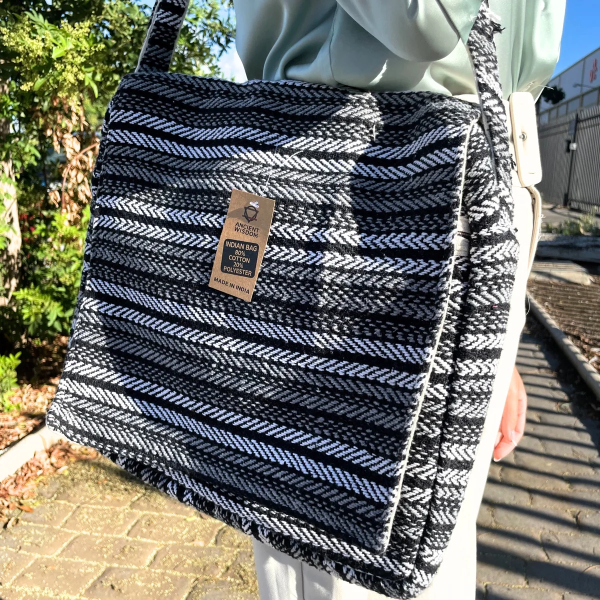 Grey striped soft Banjar lightweight laptop bag shown from the side with visible handle and zippered compartments