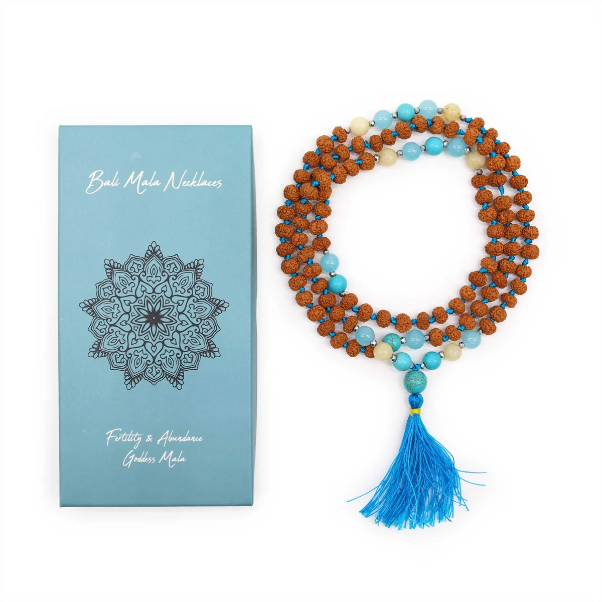 Bali mala necklace with natural beads symbolizing fertility and abundance on a white background