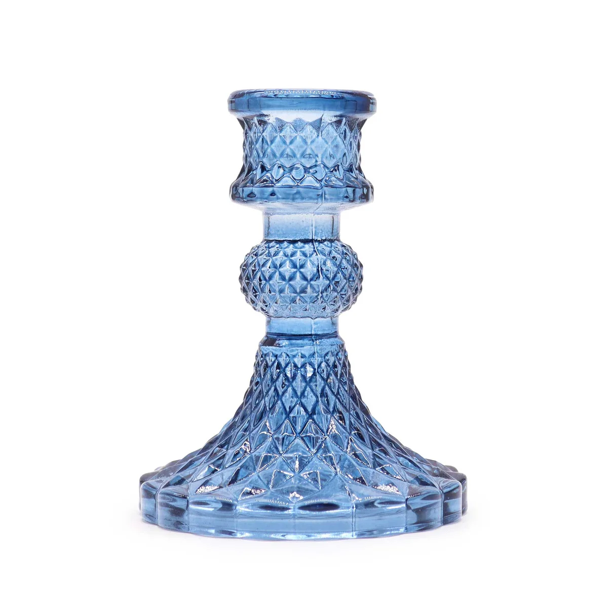 Royal blue vintage candle holder displayed on a table surface.