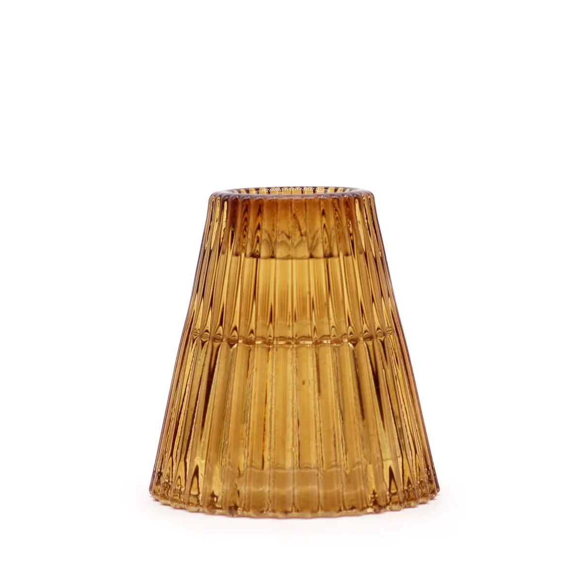 Decorative candle holder in antique amber, holding a flip dinner candle.