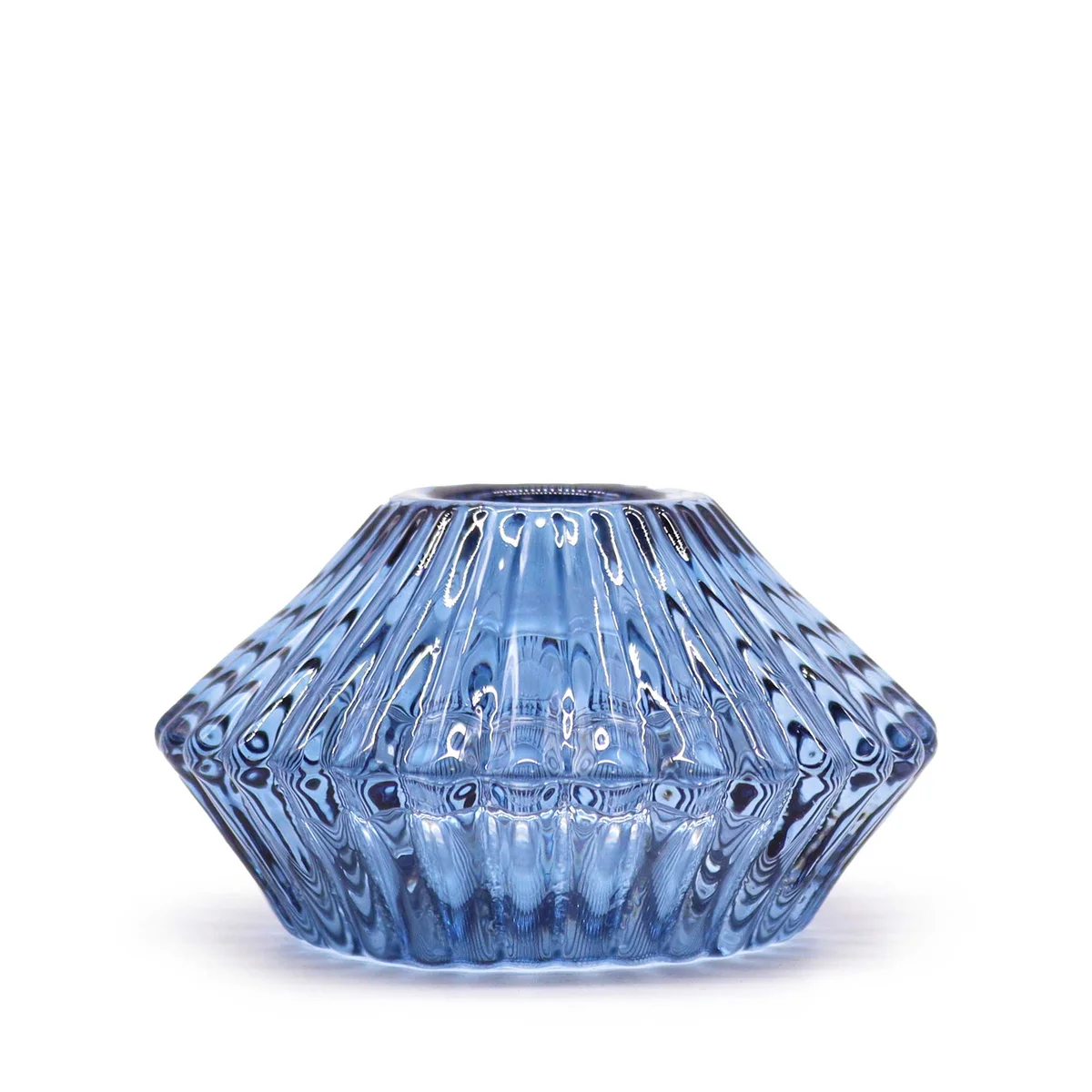 Royal blue candle holder with flower‑flip design, holding a tealight.
