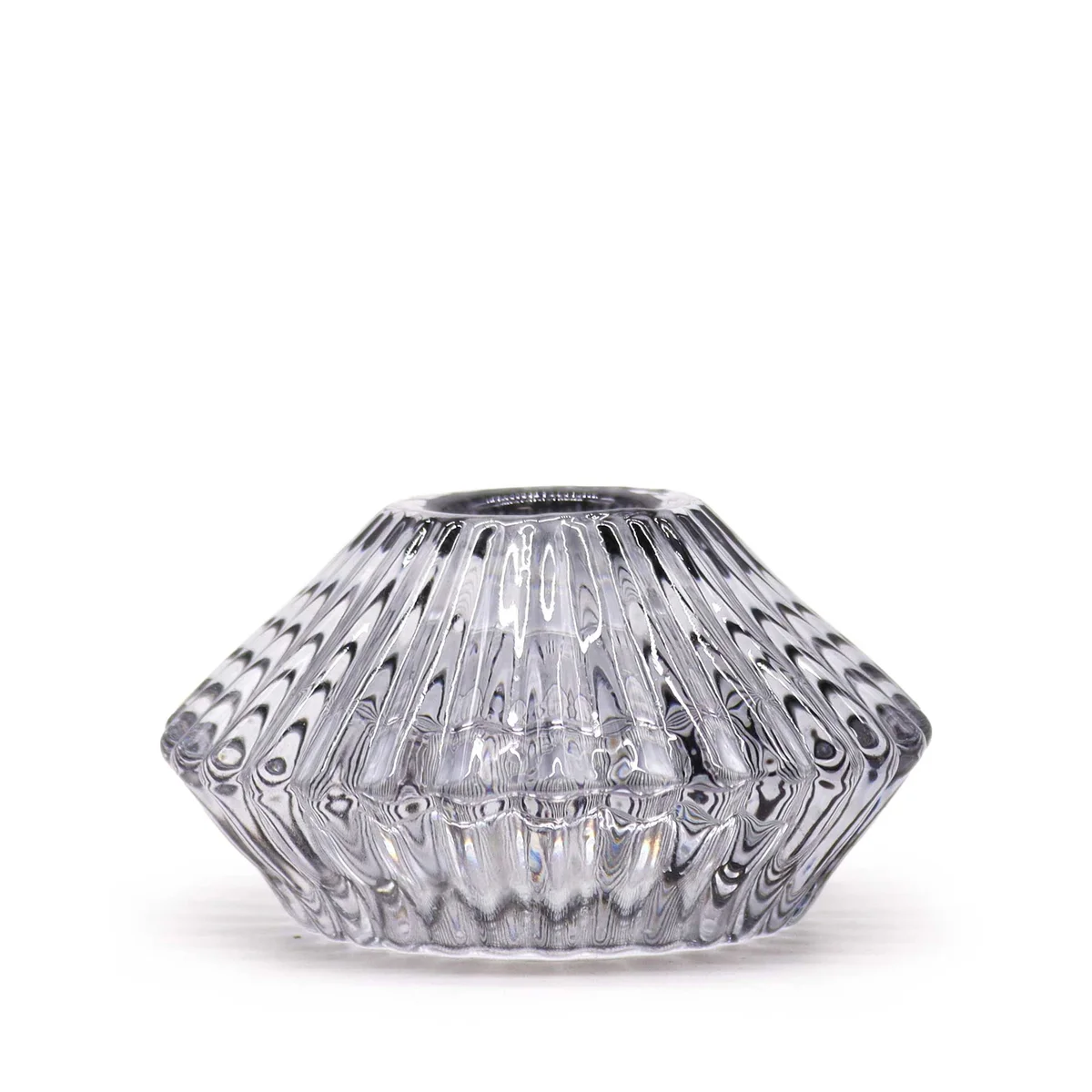 Midnight grey, flower‑shaped dinner candle holder holding a tealight. Elegant decorative piece.