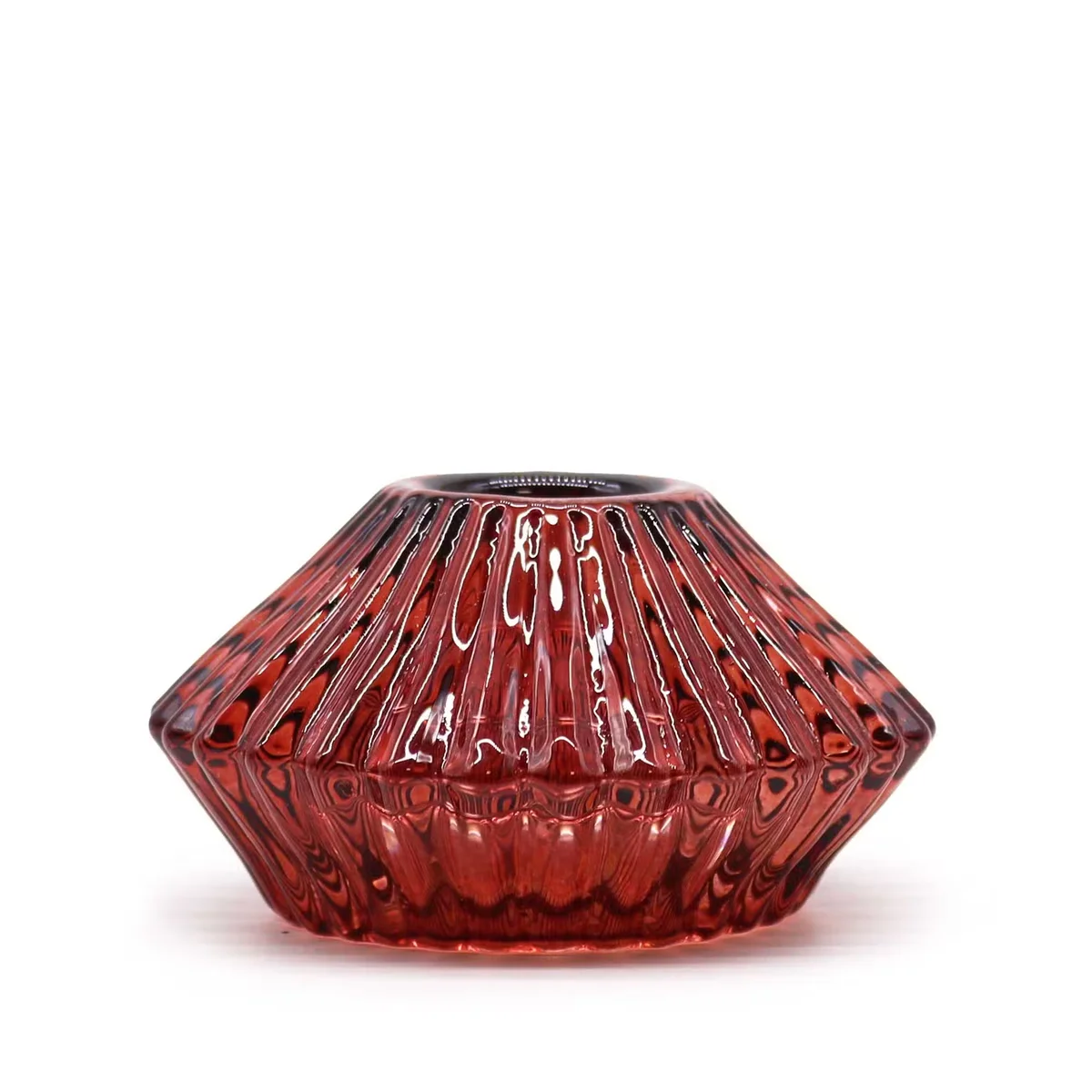 vampire red candle seated in a flower flip dinner holder, tealight visible.
