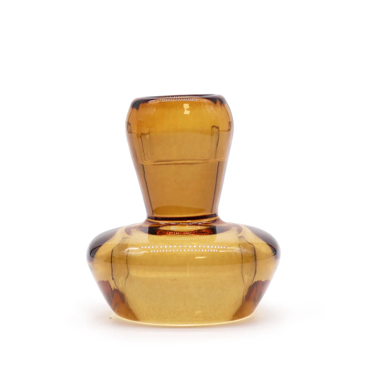 Antique amber mushroom flip dinner candle holder with a tealight resting inside, featuring a small cap and hollow base.