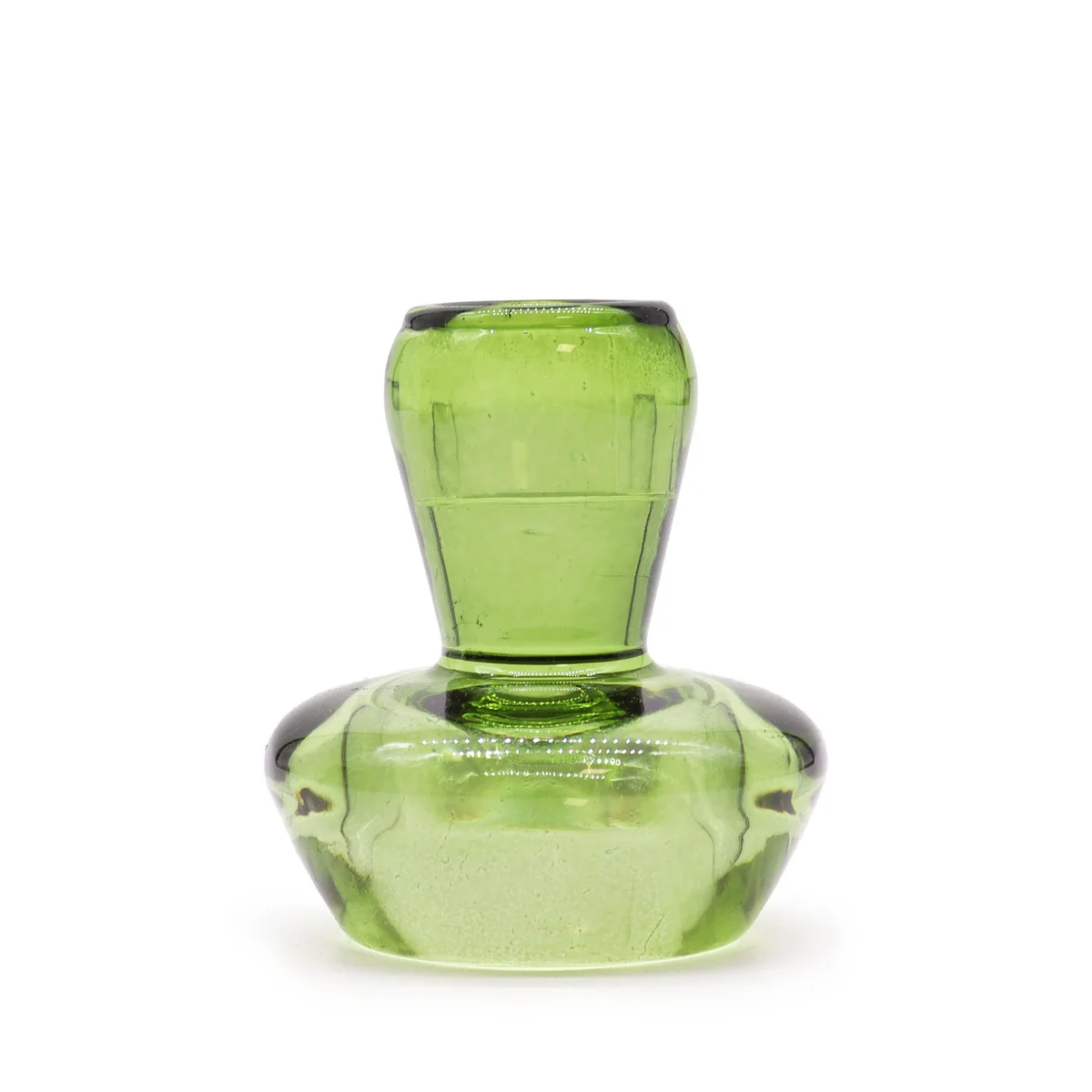 Mushroom tealight holder in garden jade with flip lid, positioned on a table showing a tealight candle inside.