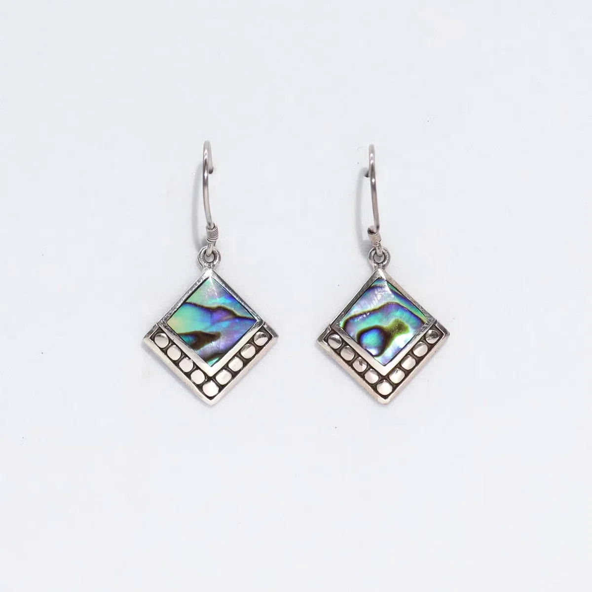 Silver shell earrings featuring square dot design on abalone shell jewellery.