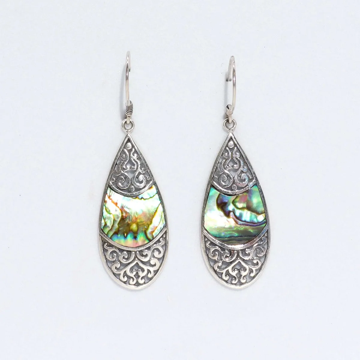 Silver teardrop oval earrings featuring abalone shell