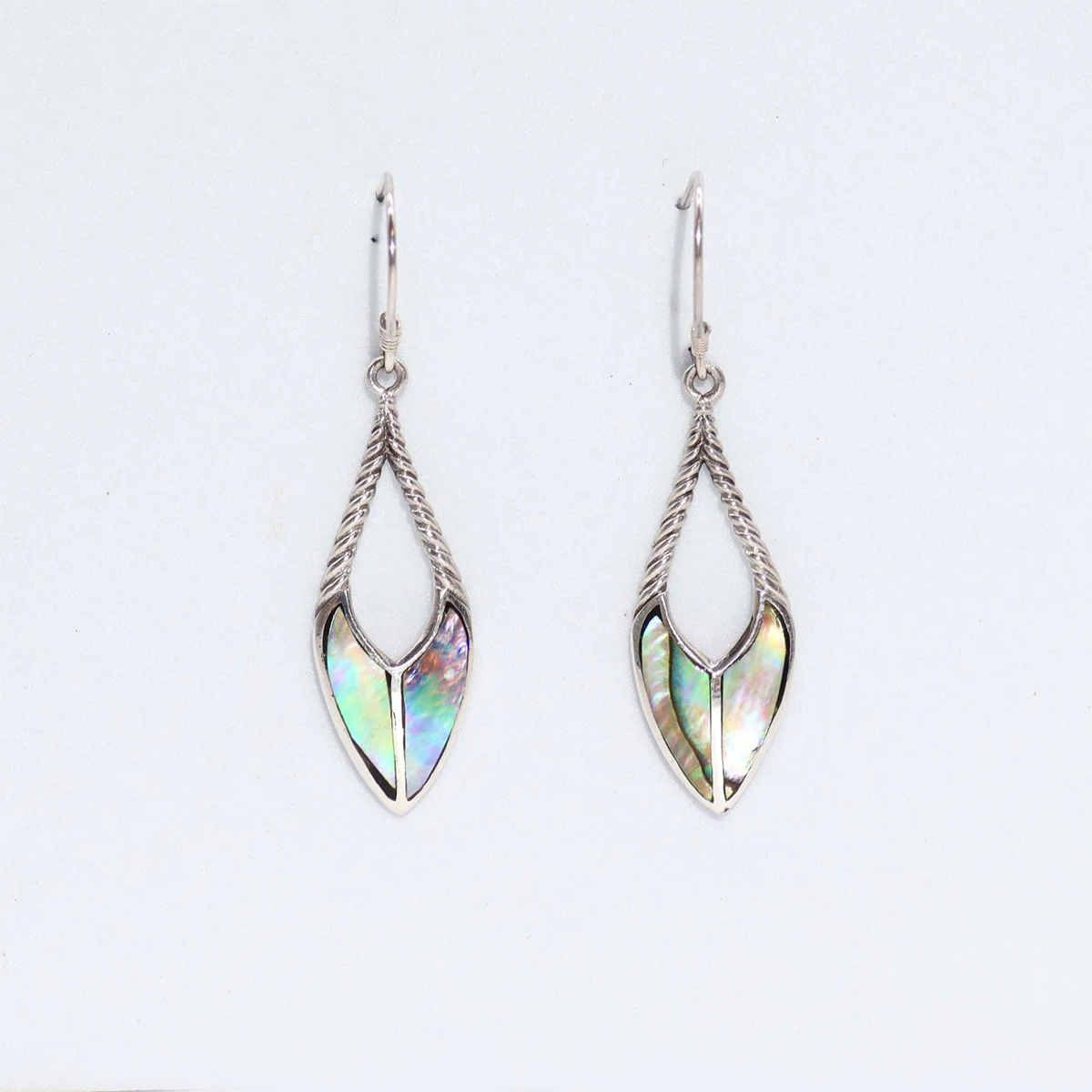 Shell silver earrings with spear drop design featuring iridescent abalone shell accents on silver hooks