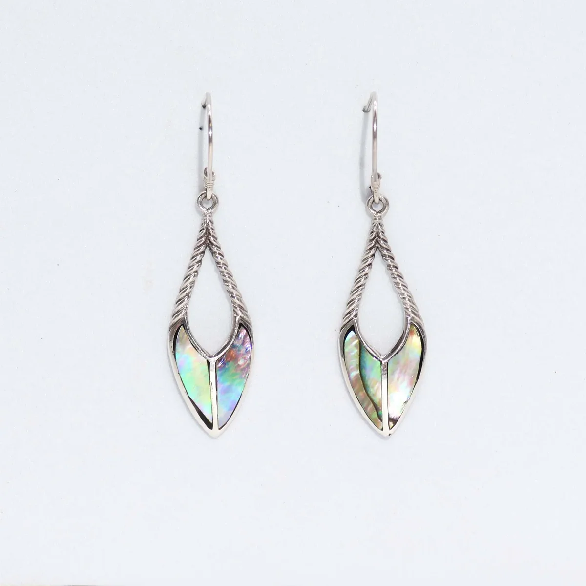 Shell and silver spear drop abalone earrings with iridescent shell detail on a white background