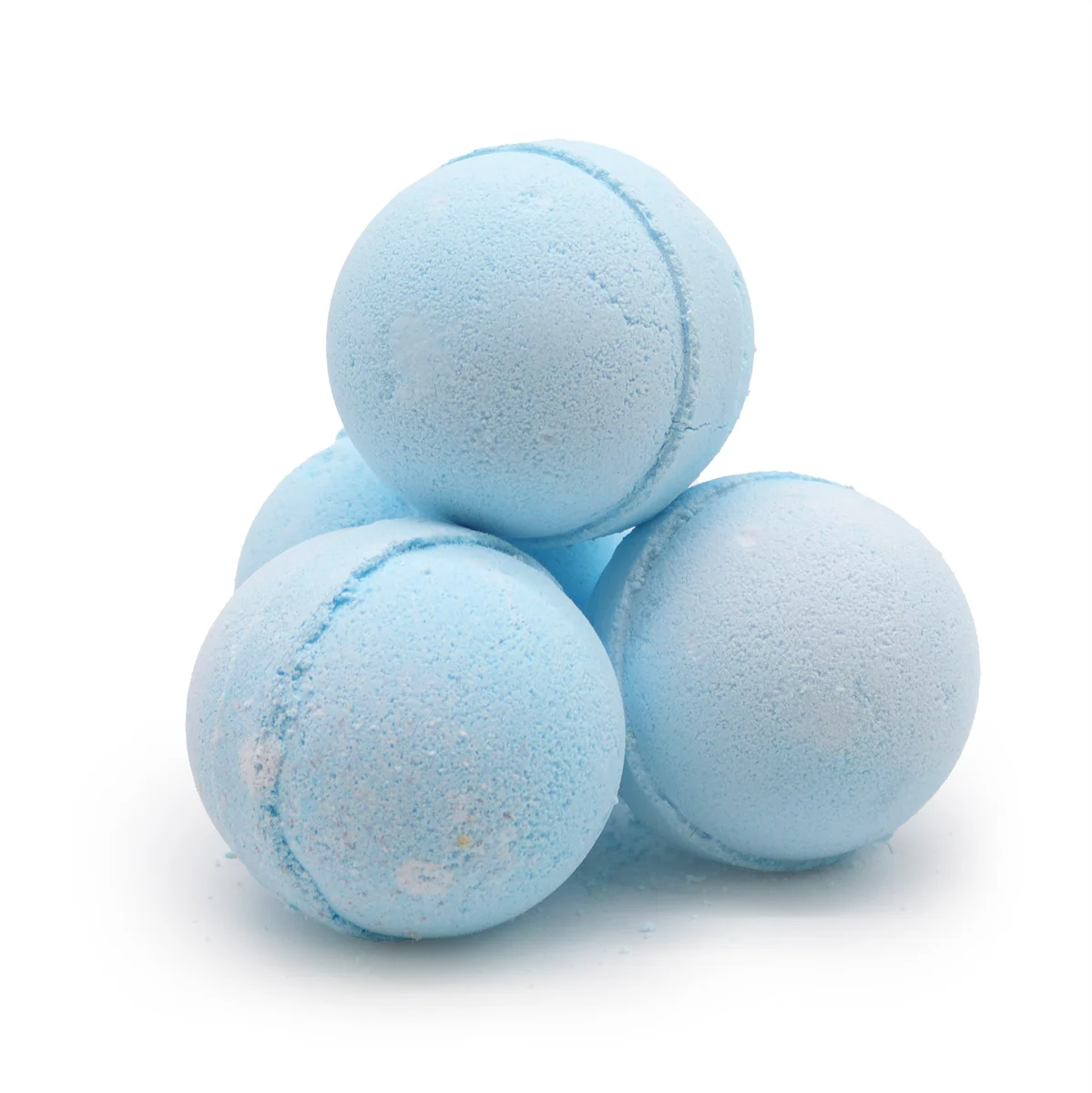 Marjoram bath bomb with lavender scent in a clear plastic bottle on a bathroom stone table.