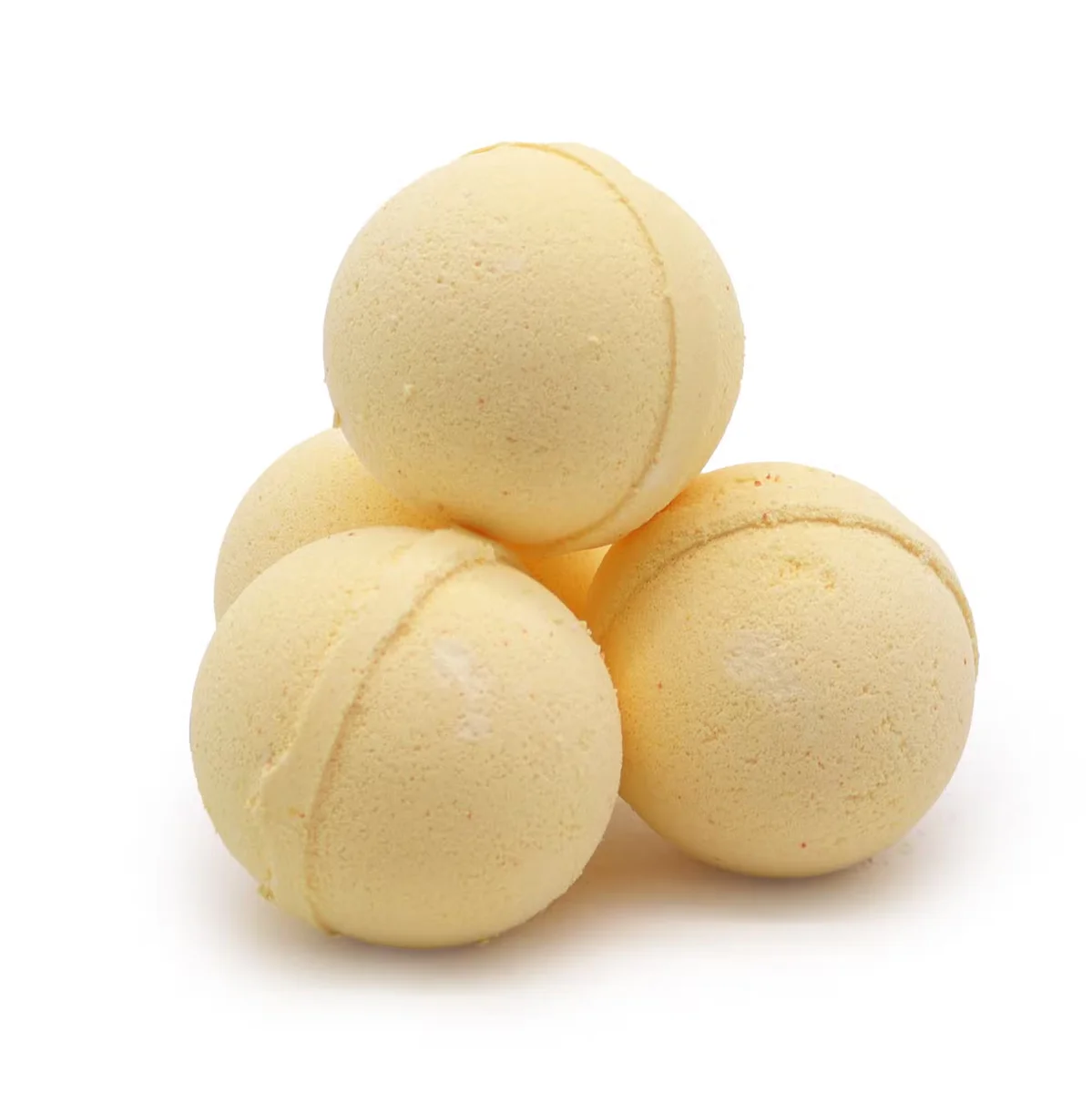 Chamomile and grapefruit aromatherapy bath bomb in a small round package.