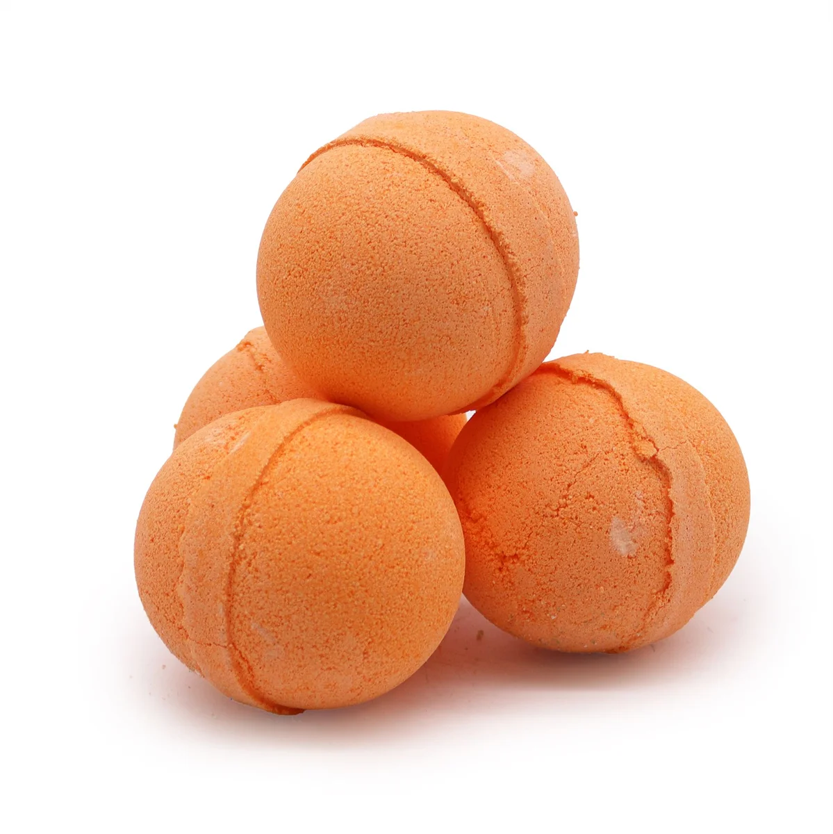 Essential oil bath bomb in lemongrass and mandarin fragrance, shown in a clear glass jar.