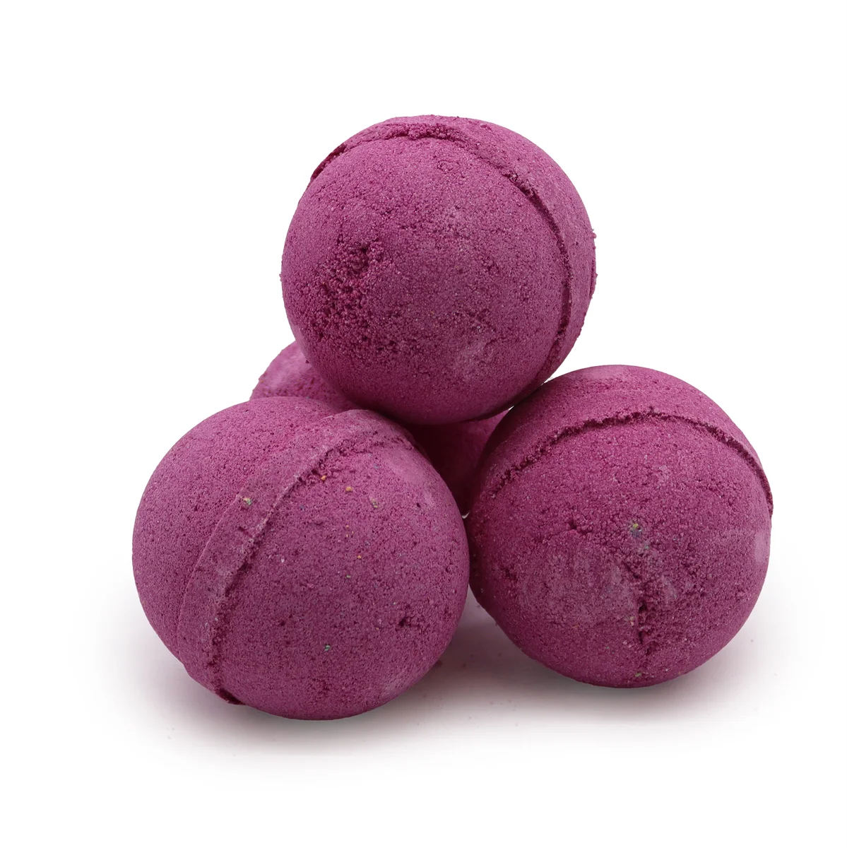Ginger bath bomb infused with Ylang Ylang, ready to dissolve in hot water.