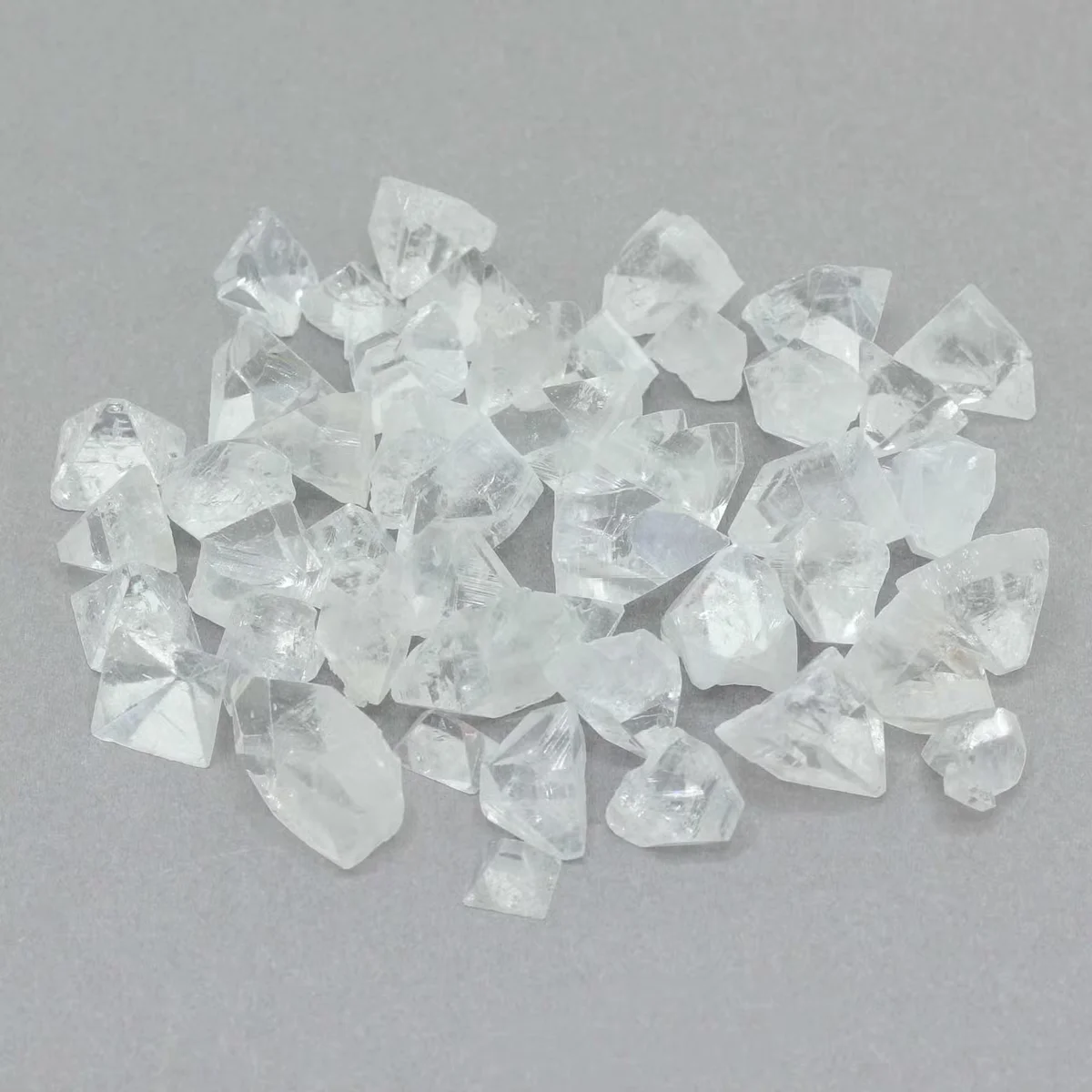 Small bag of 100g apophyllite stones, each 7‑10mm tips, white mineral shards.