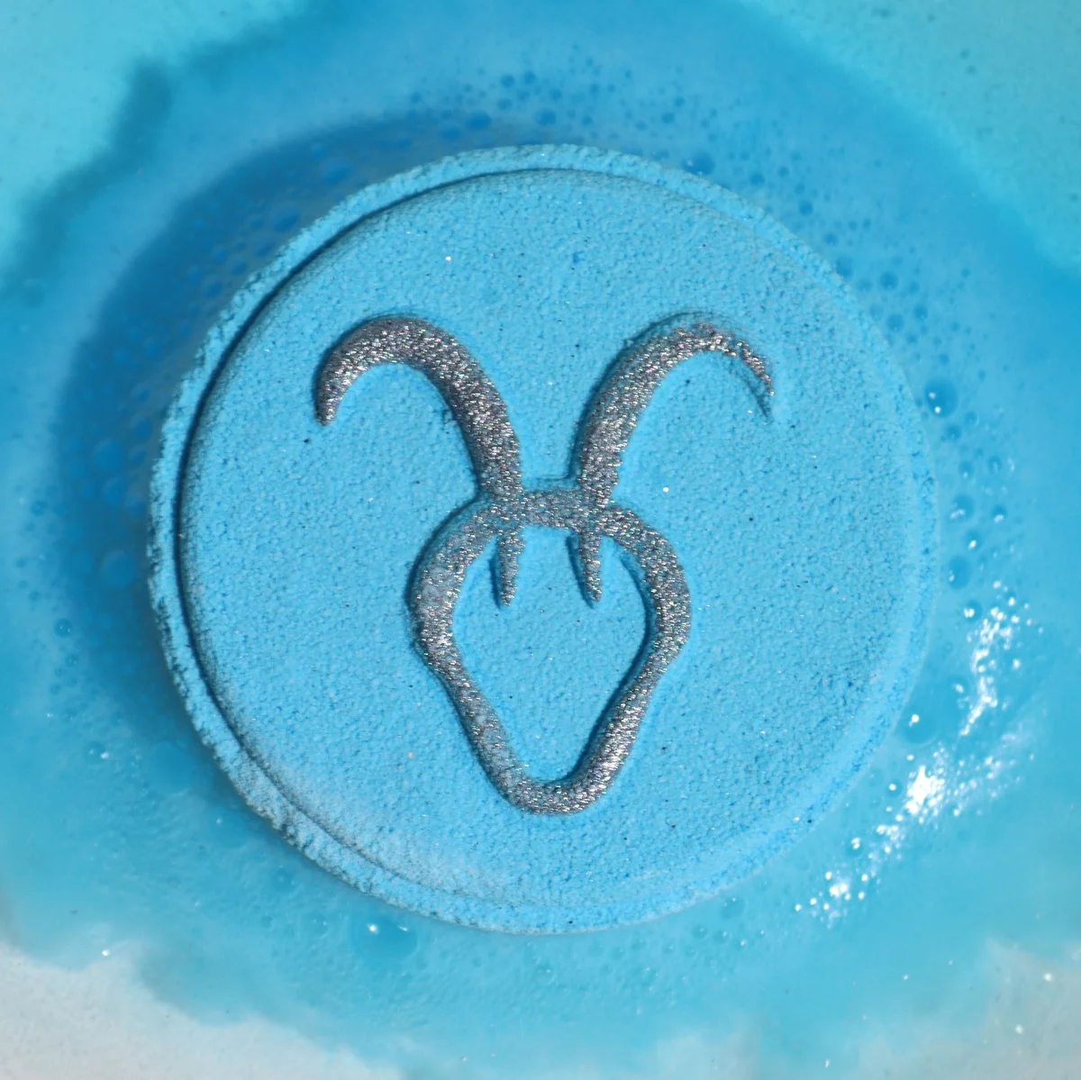 Set of horoscope bath bombs featuring Capricorn zodiac symbols, styled as a decorative bath fizzers collection.