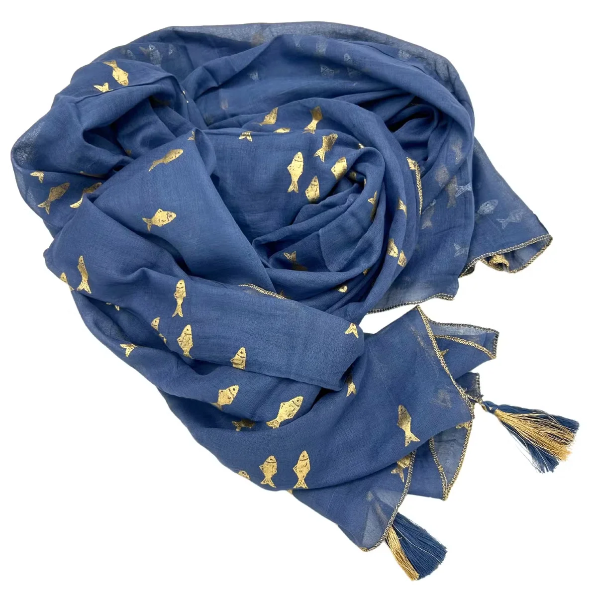 Lightweight beach wrap in sea blue with gold fish print, styled as a sari pareo draped over a mannequin.
