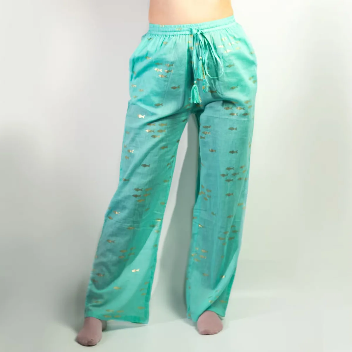 Turquoise nomad sari pants with hand‑painted gold fish design