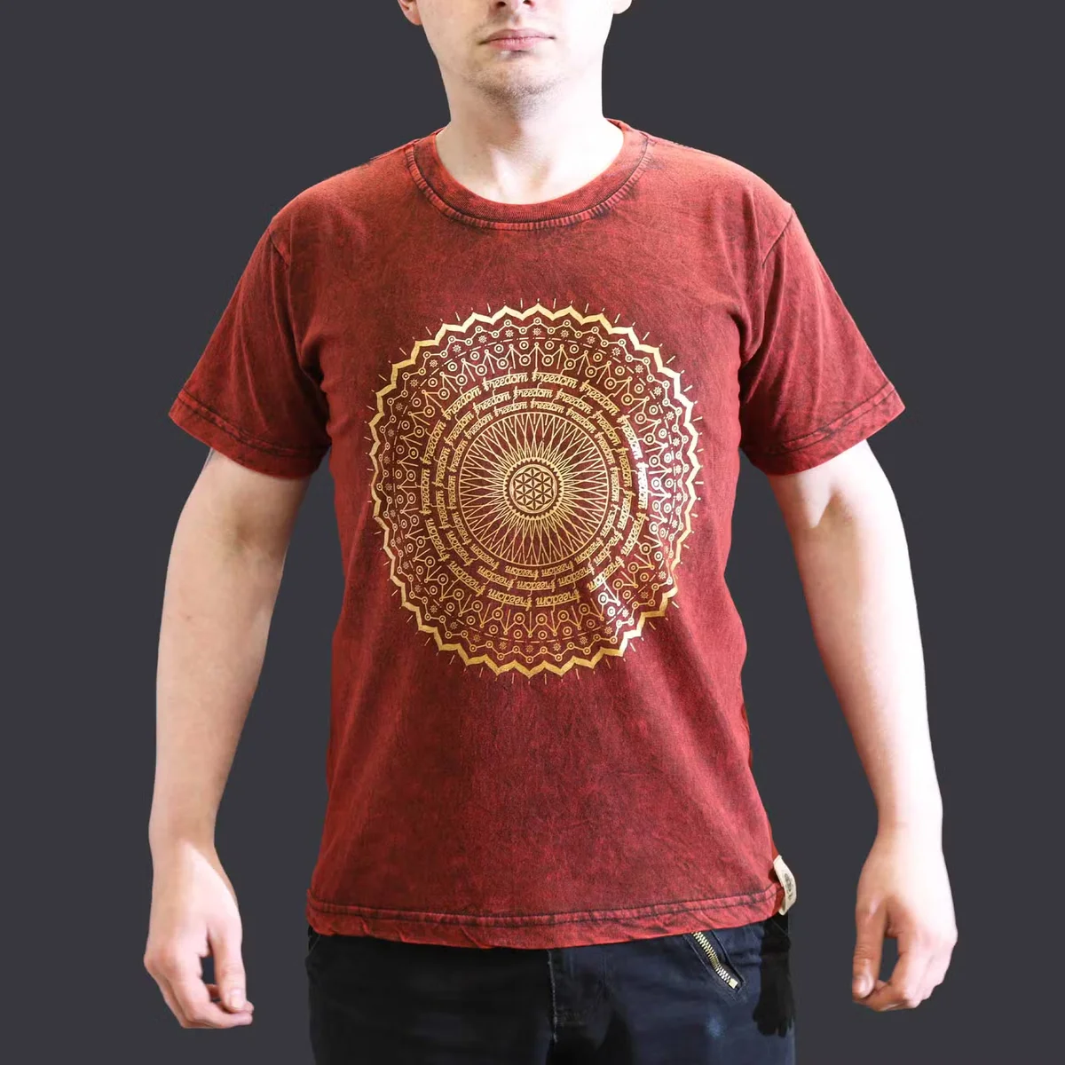 Maroon small stone washed tee with intricate mandala design on front, folded neatly on plain background