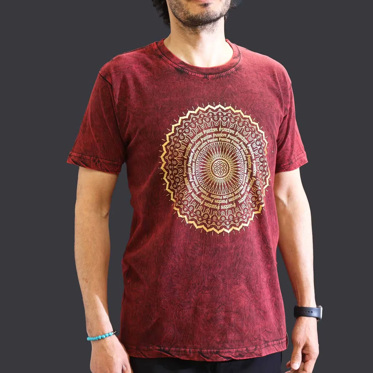 Maroon medium t-shirt with stone washed effect featuring a mandala design on the front, displayed flat
