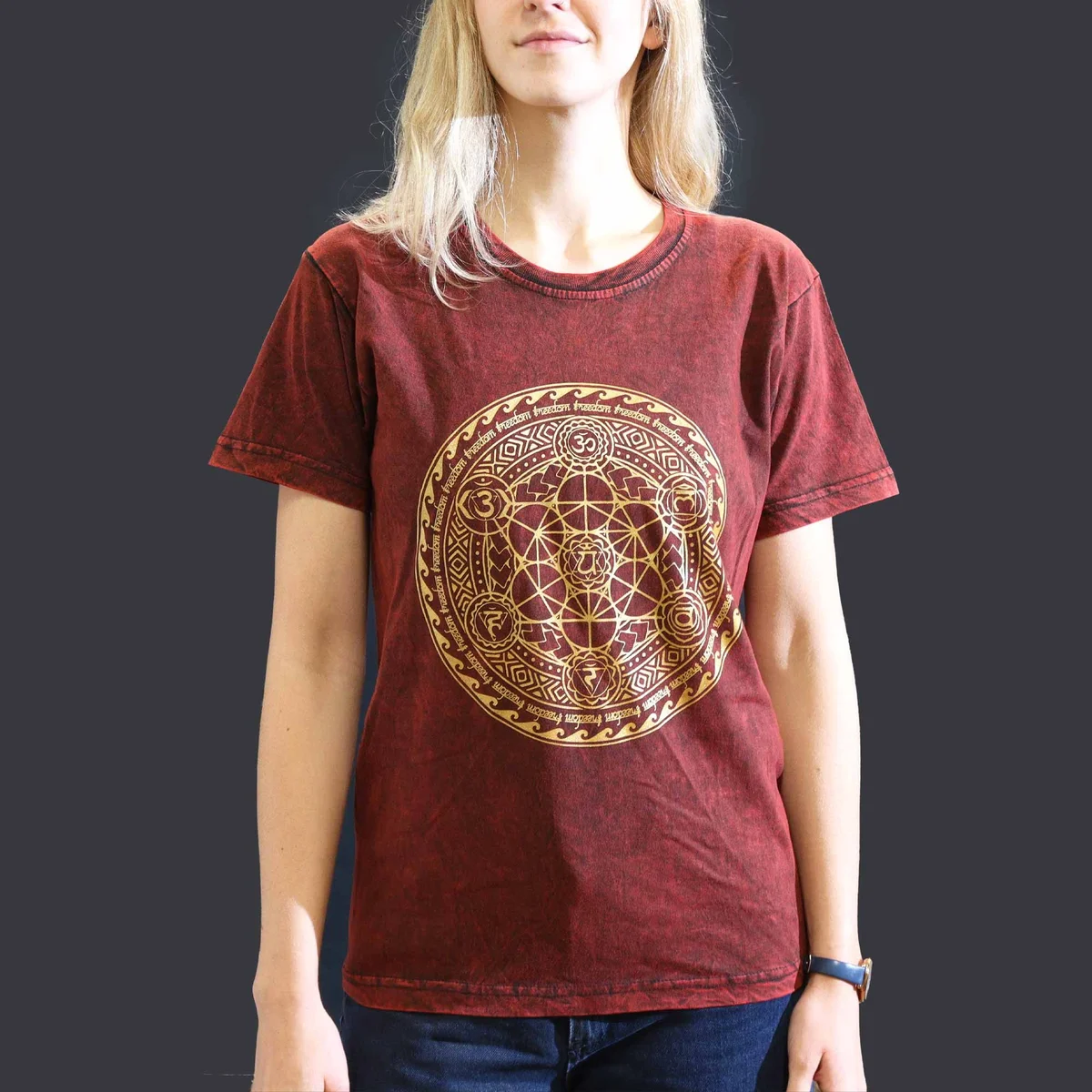 Maroon small stone washed t-shirt with chakra design on front, laid flat against white background