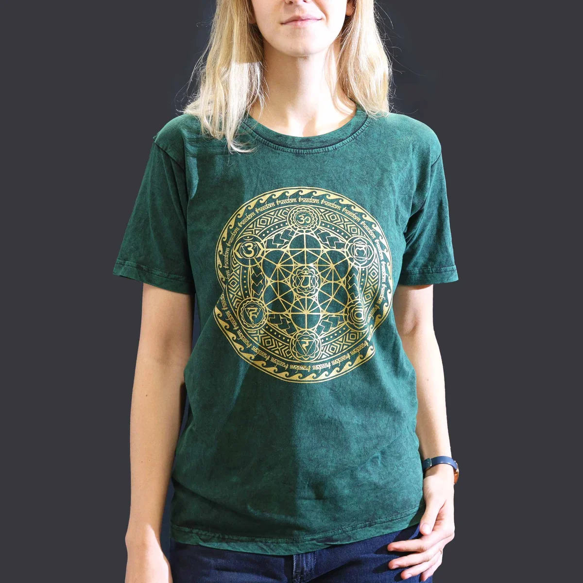 Green small stone washed tee with chakra design, laid flat showing front and short sleeves on white background