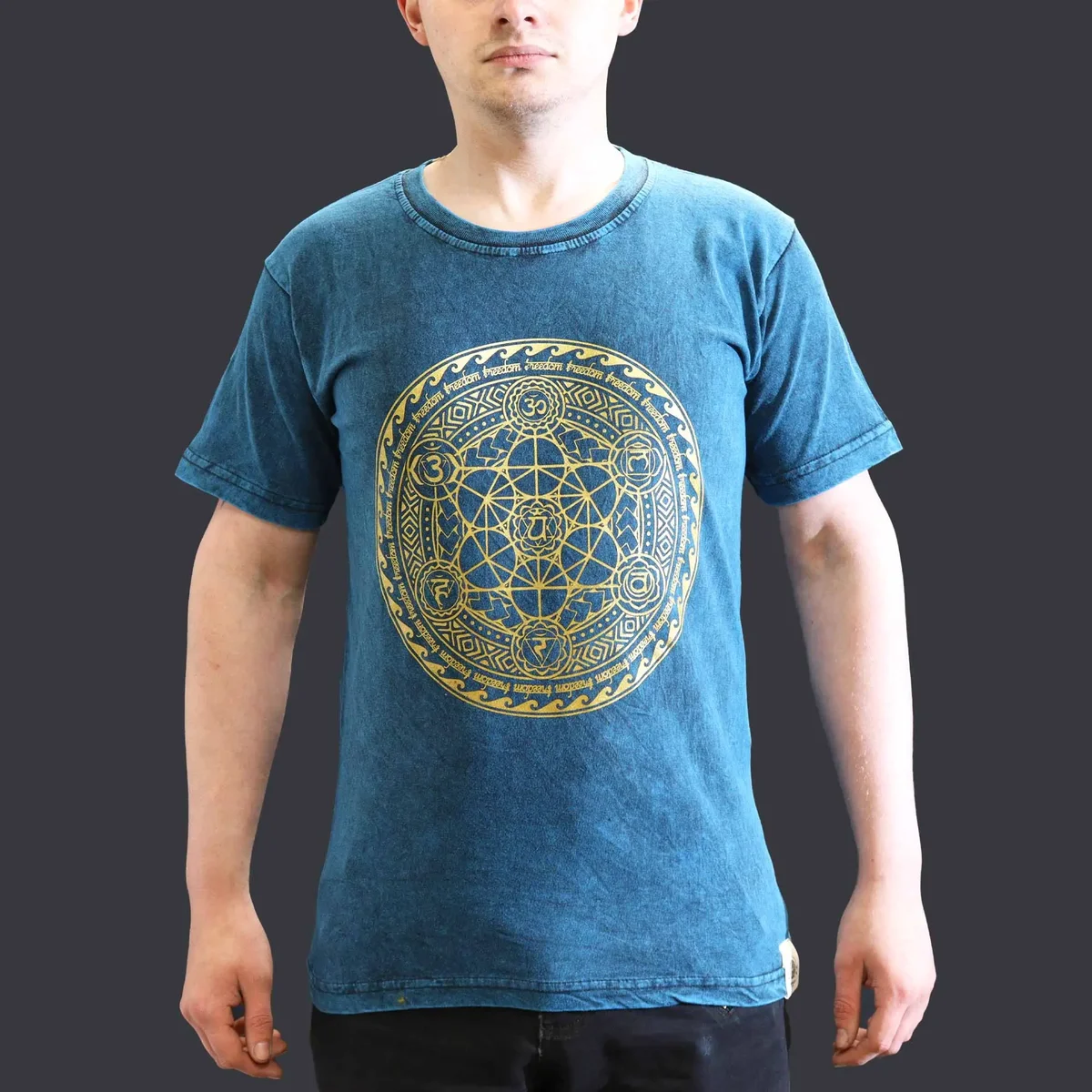 Blue chakra t-shirt with small stone washed fabric, short sleeves, and round neckline on plain background