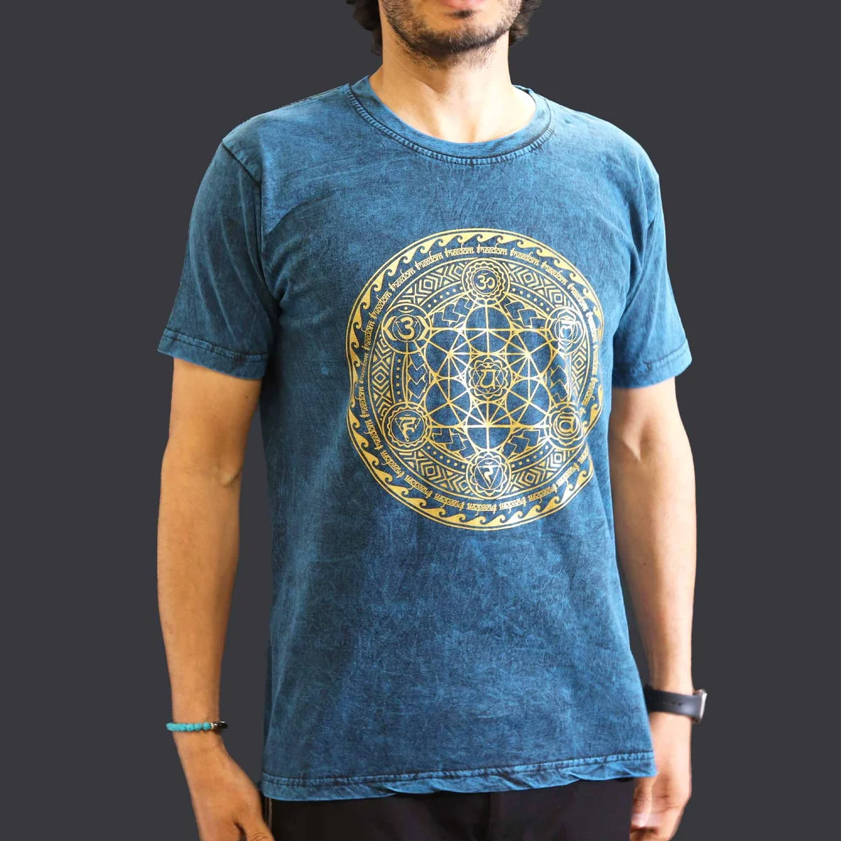 Blue medium stone washed t-shirt featuring a chakra design on the front, displayed on a plain background