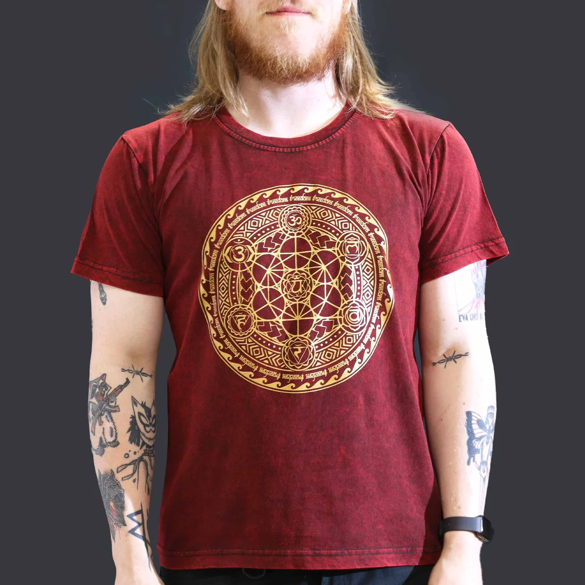 Maroon large stone washed chakra t-shirt laid flat showing front design and texture details